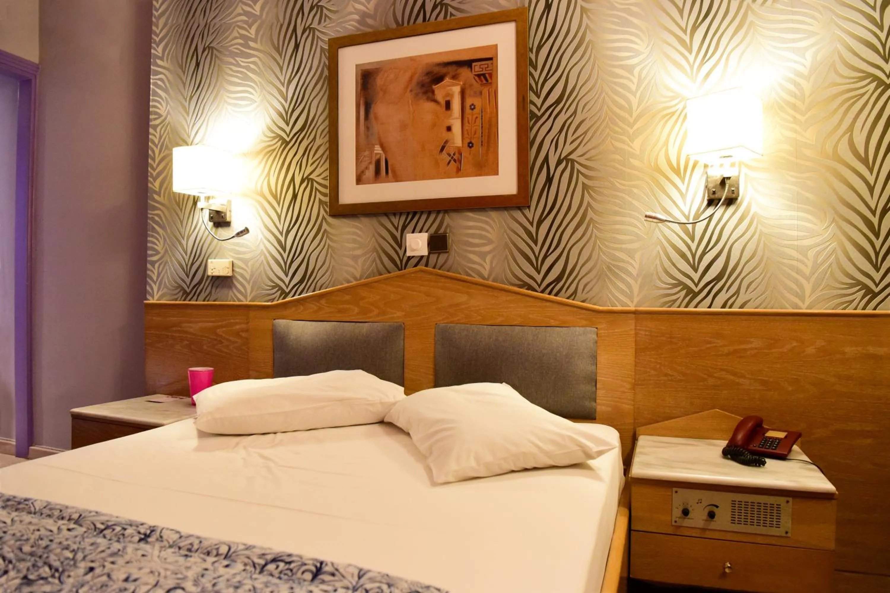 Bed in Eva Hotel Piraeus