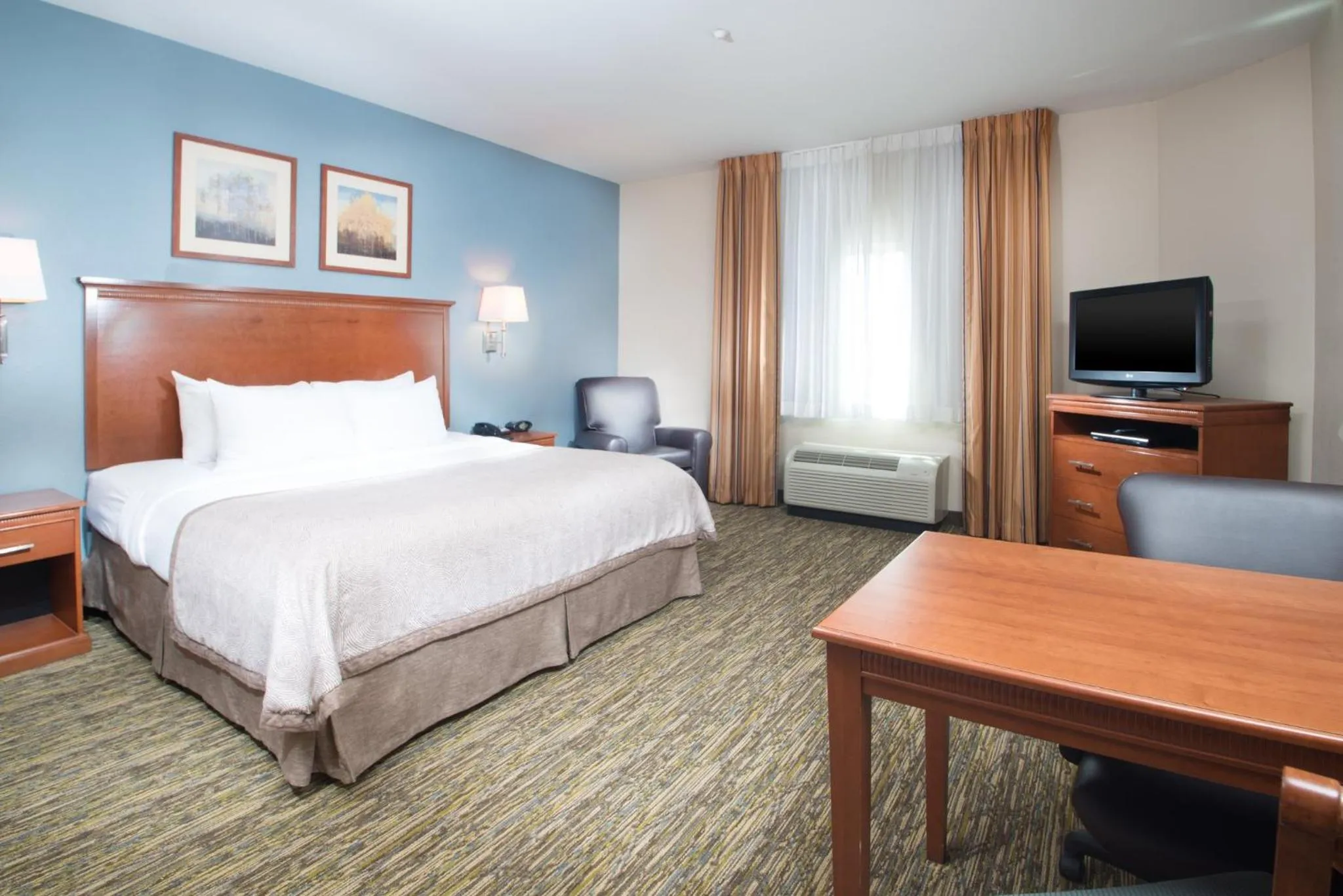 Photo of the whole room, Bed in Candlewood Suites Wake Forest-Raleigh Area by IHG