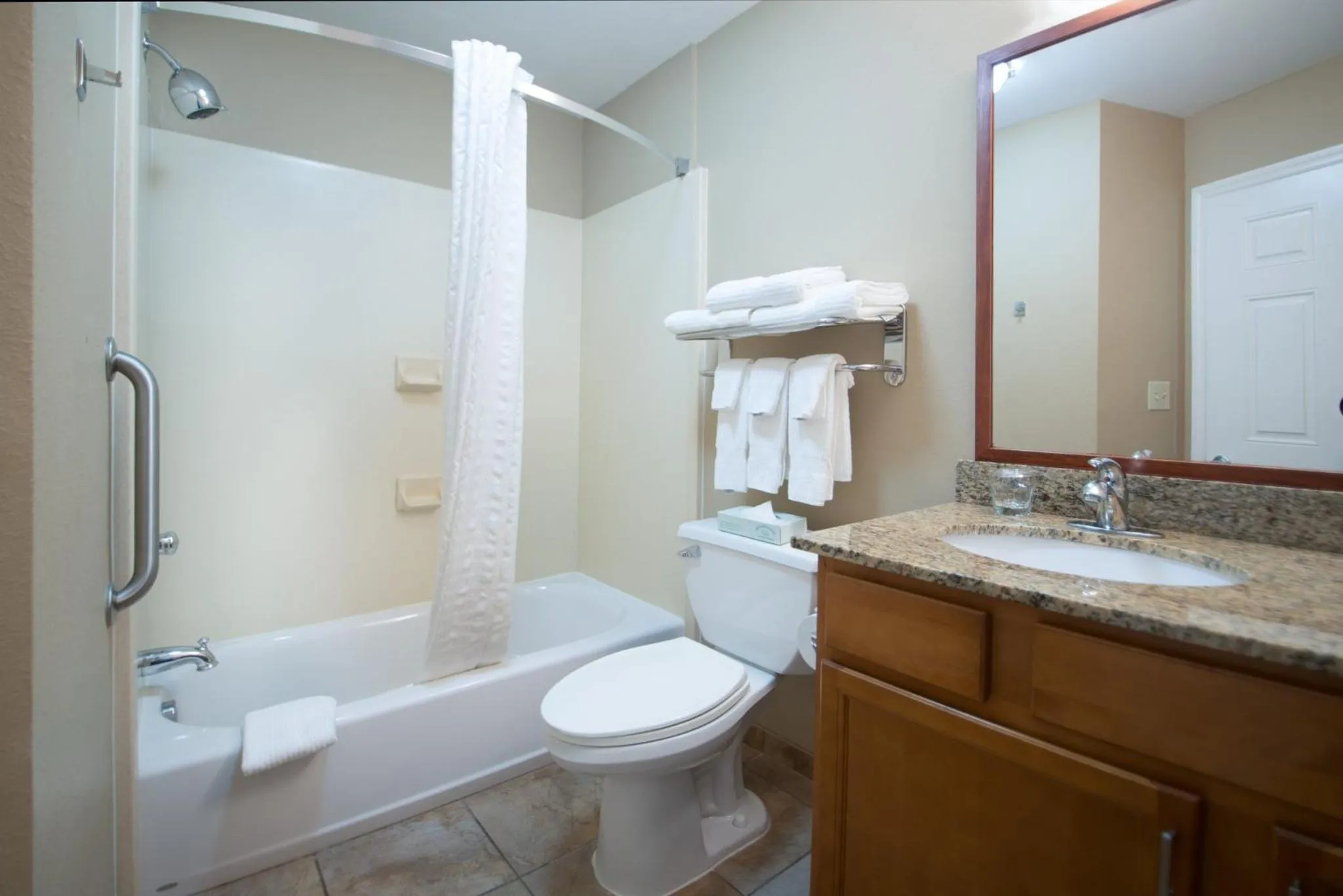 Bathroom in Candlewood Suites Wake Forest-Raleigh Area by IHG