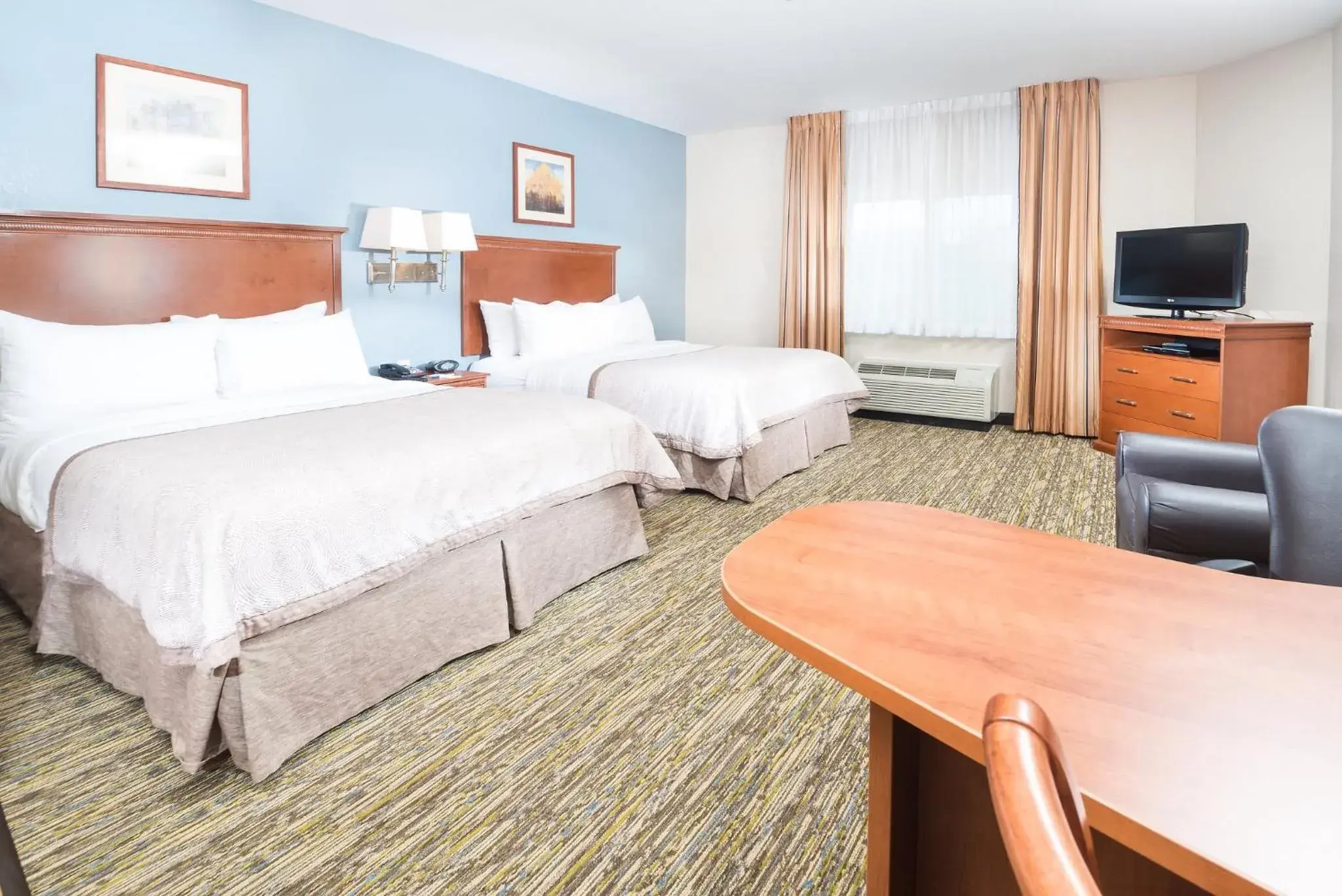 Photo of the whole room, Bed in Candlewood Suites Wake Forest-Raleigh Area by IHG Photo of the whole room, Bed in Candlewood Suites Wake Forest-Raleigh Area by IHG