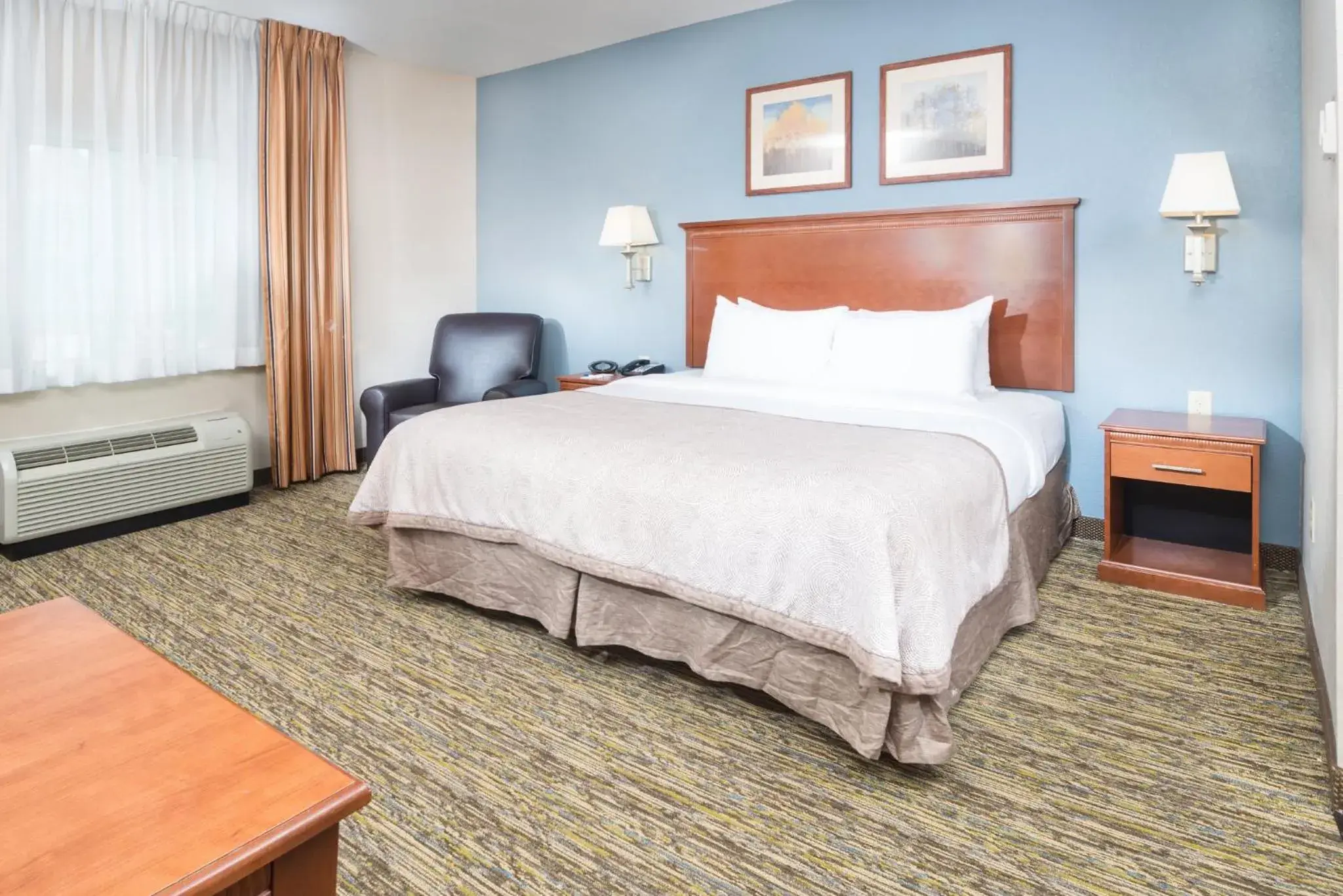 Photo of the whole room, Bed in Candlewood Suites Wake Forest-Raleigh Area by IHG Photo of the whole room, Bed in Candlewood Suites Wake Forest-Raleigh Area by IHG