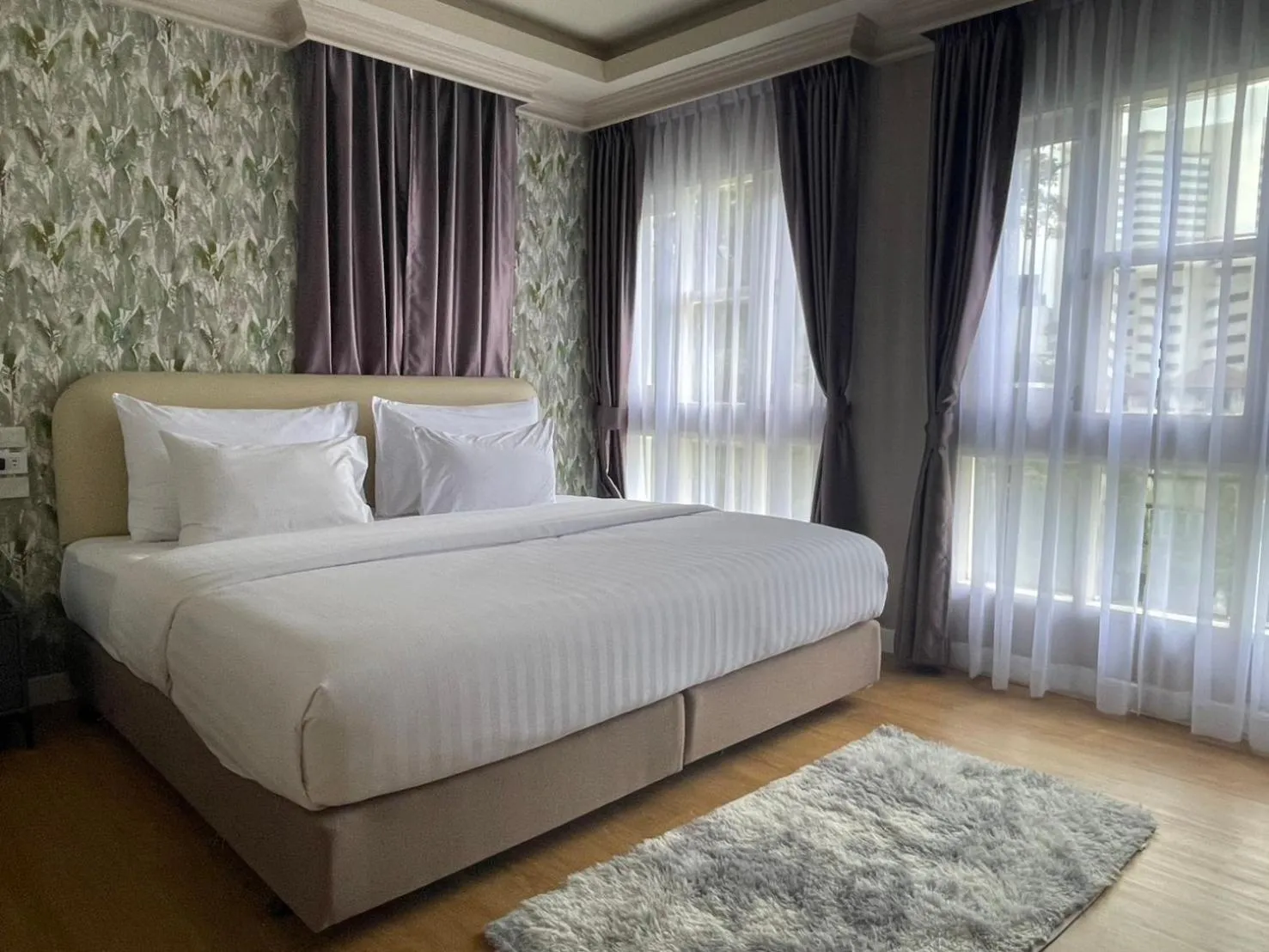 Bed in V20 Boutique Jacuzzi Hotel