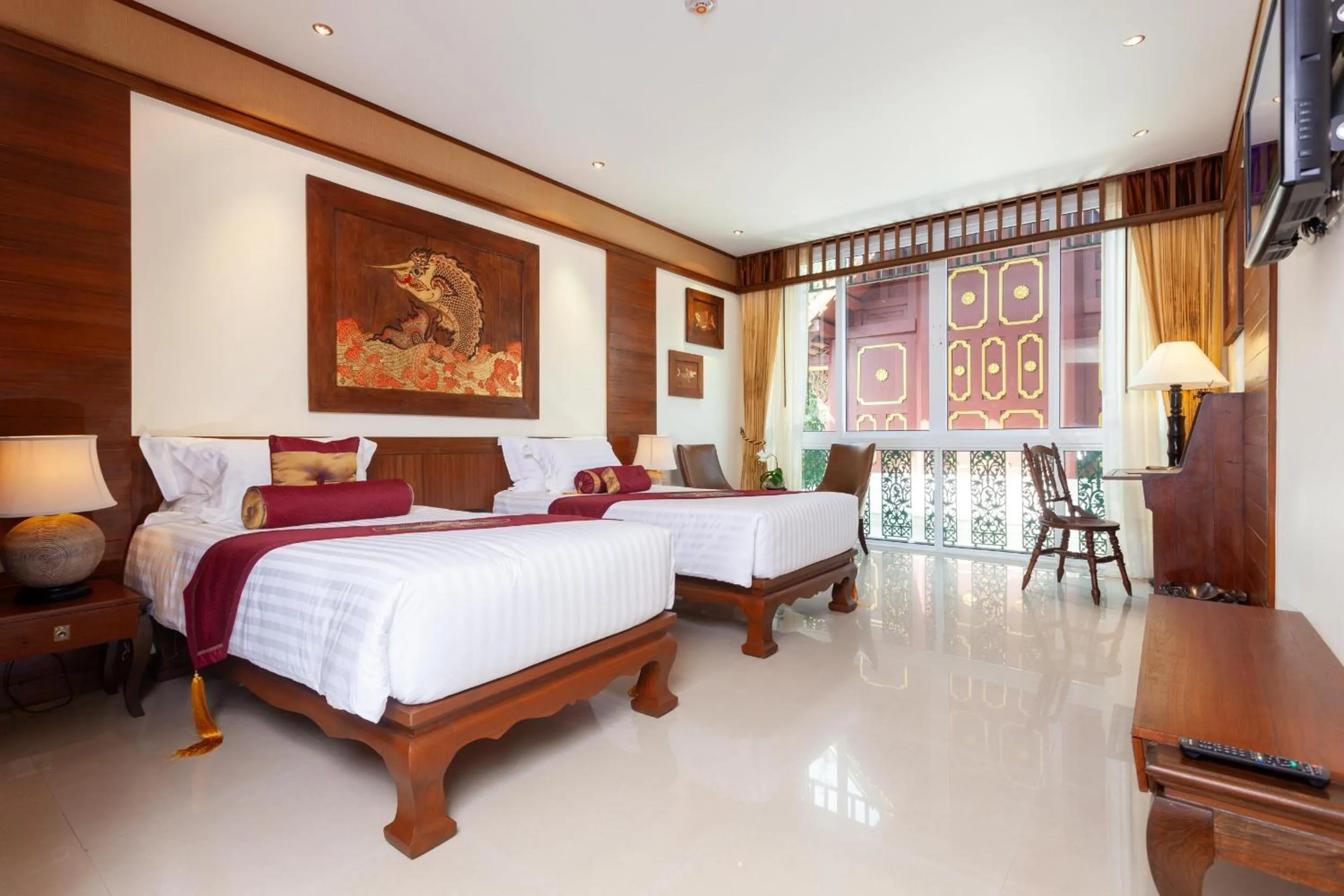 Photo of the whole room, Bed in Kodchasri Thani Hotel Chiangmai