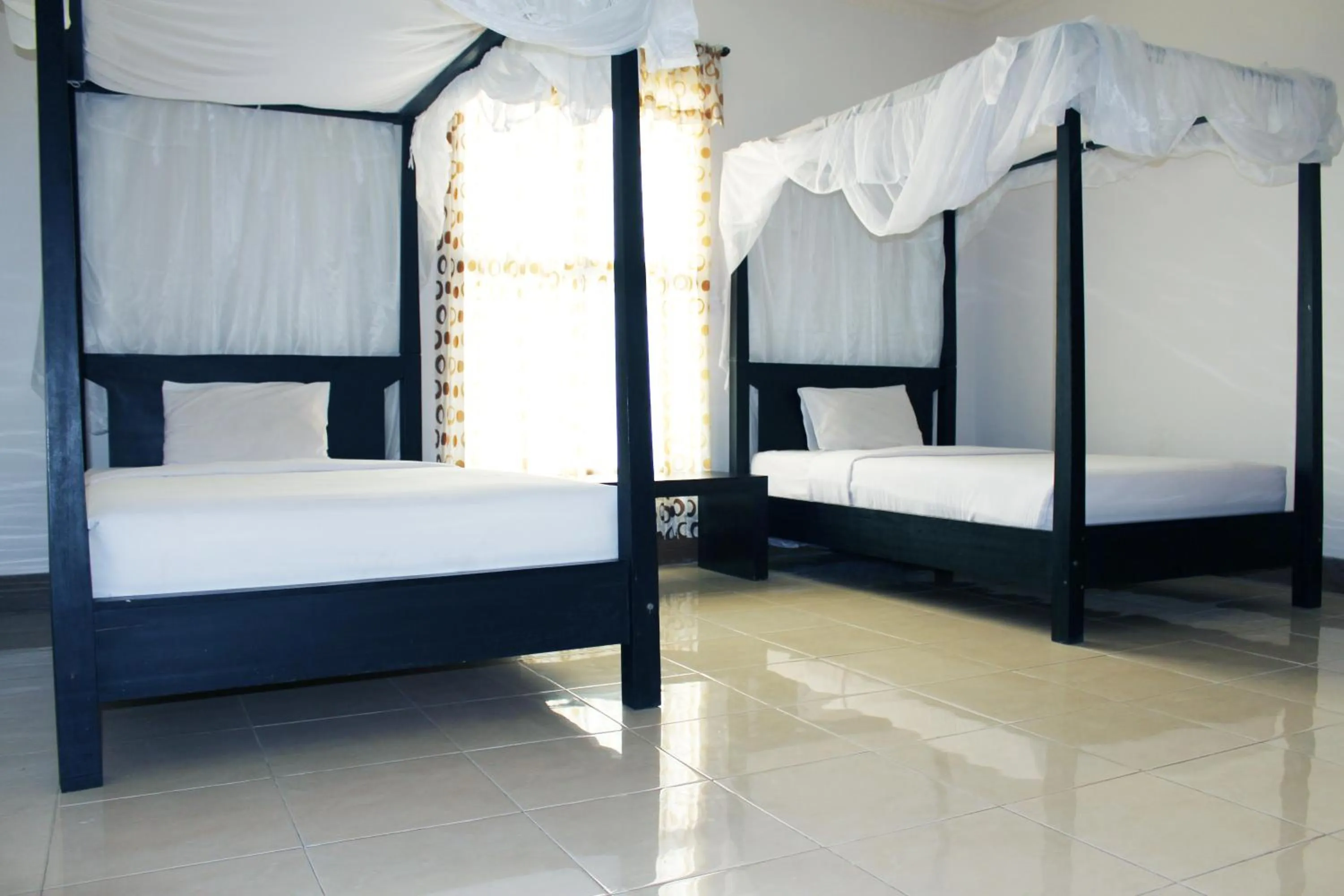 Bed in Aman Gati Hotel Lakey