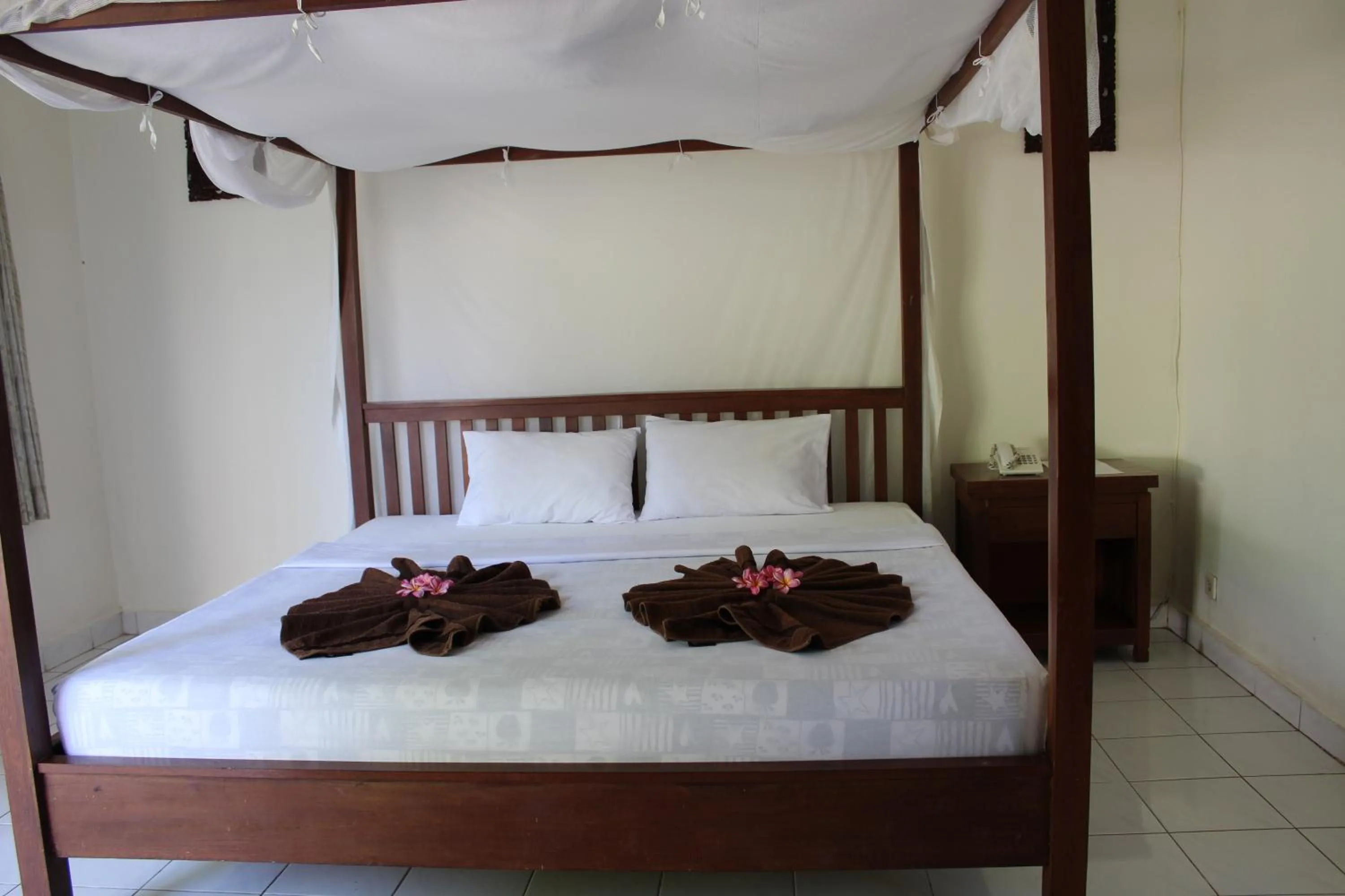 Bed in Aman Gati Hotel Lakey