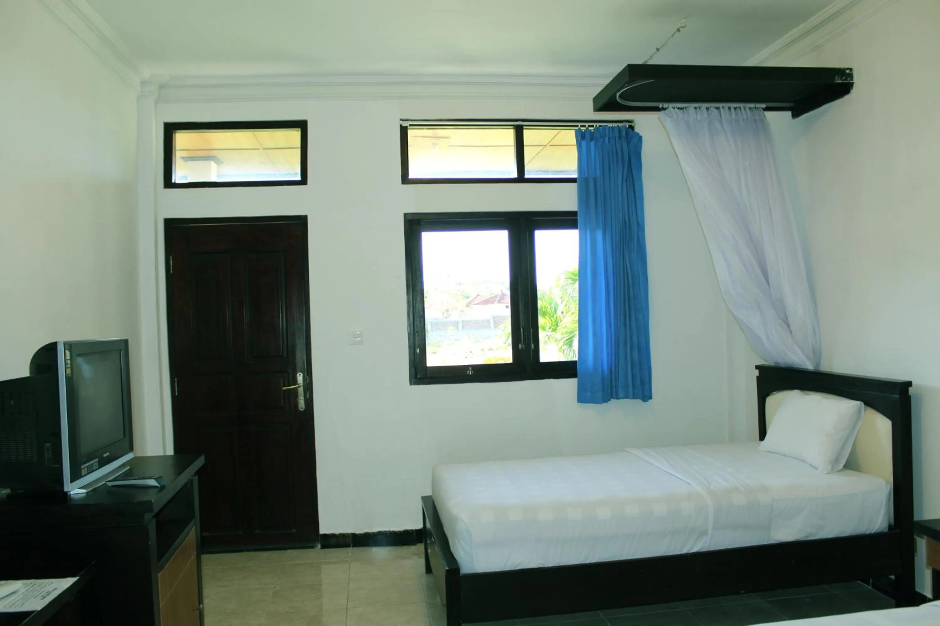 Bed in Aman Gati Hotel Lakey