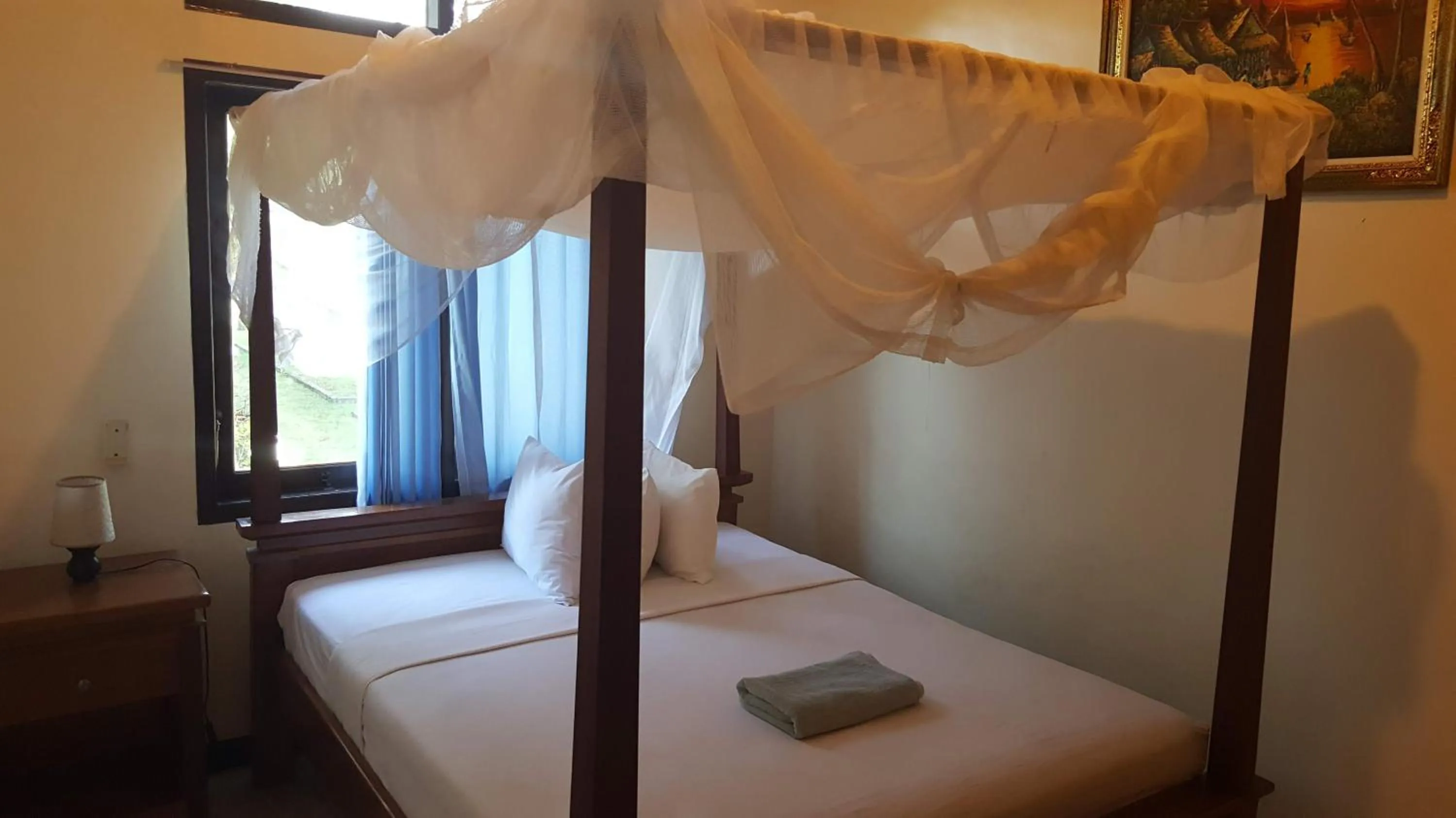 Bed in Aman Gati Hotel Lakey