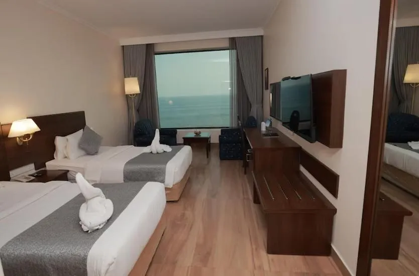 Bed in The Quilon Beach Hotel and Convention Center