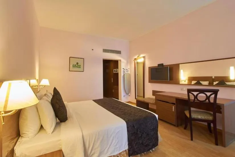 Bed in The Quilon Beach Hotel and Convention Center