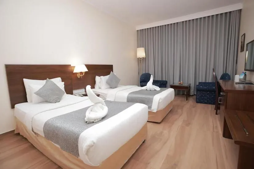 Bed in The Quilon Beach Hotel and Convention Center