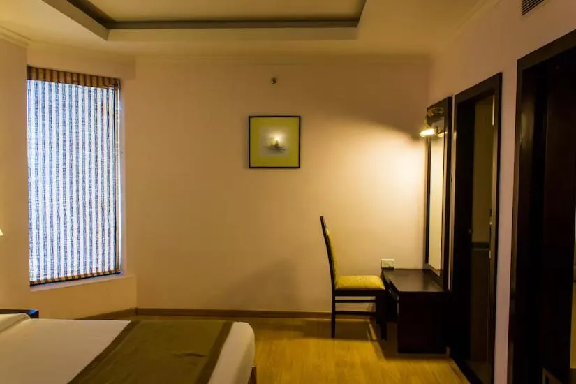 Photo of the whole room, Bed in The Quilon Beach Hotel and Convention Center