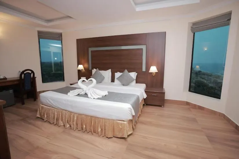 Bed in The Quilon Beach Hotel and Convention Center