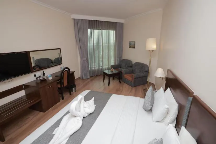 TV and multimedia, Bed in The Quilon Beach Hotel and Convention Center