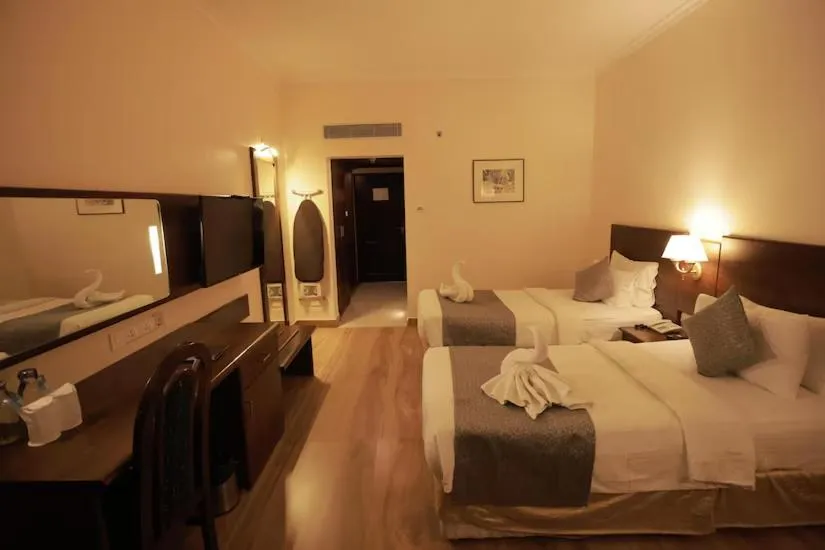 Bed in The Quilon Beach Hotel and Convention Center