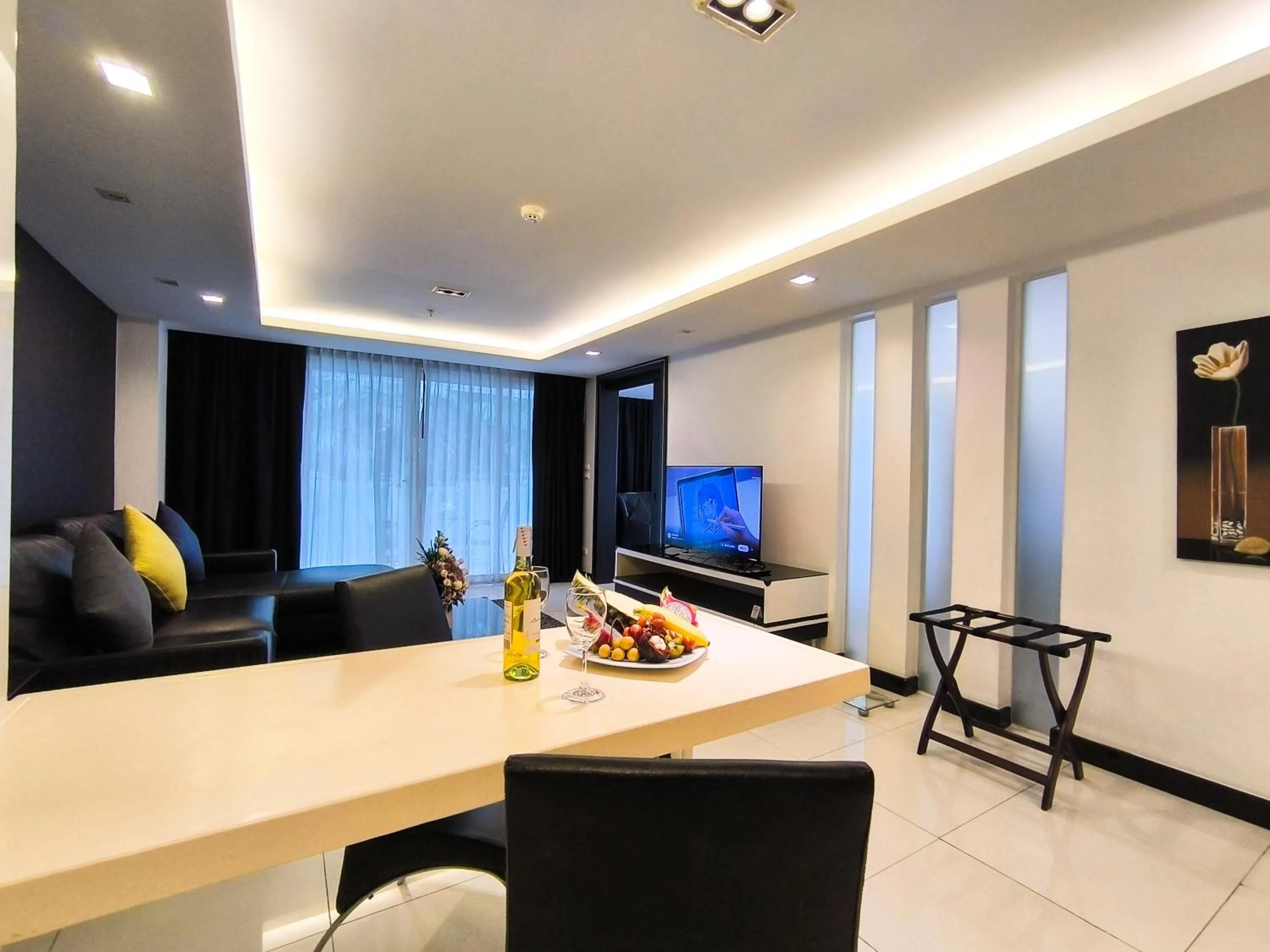 Living room in Nova Suites Pattaya by Compass Hospitality