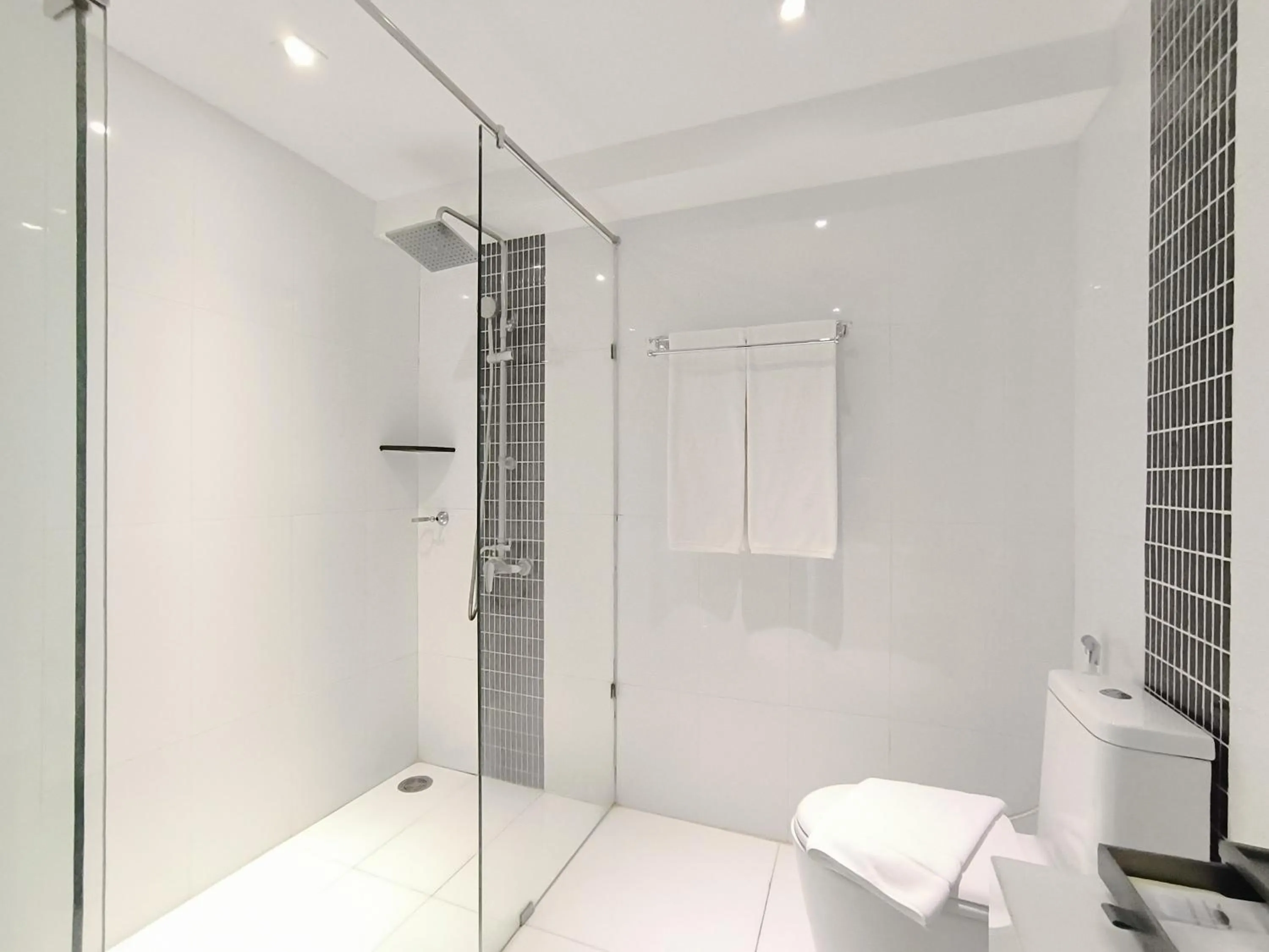 Shower in Nova Suites Pattaya by Compass Hospitality