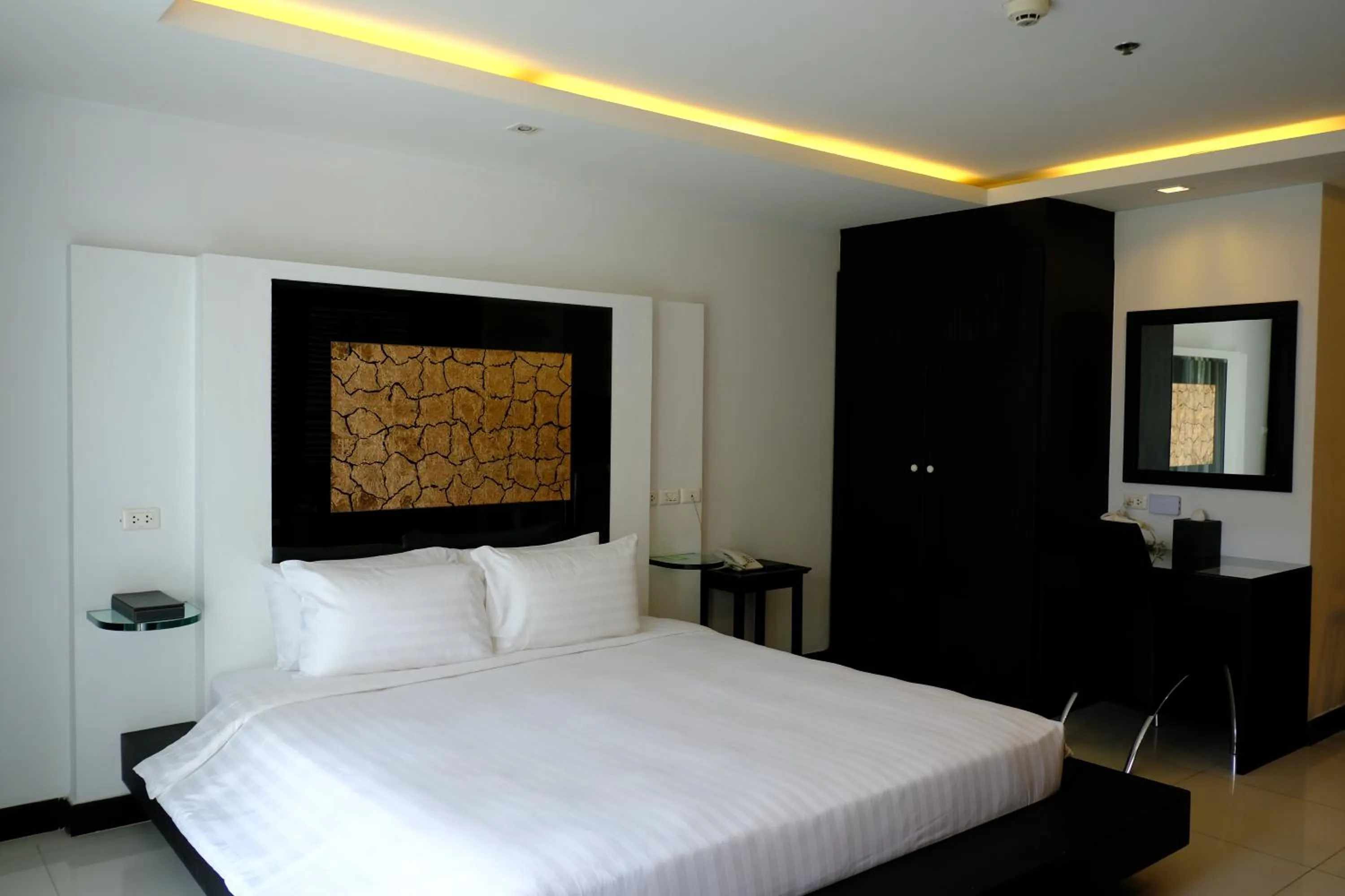 Bed in Nova Suites Pattaya by Compass Hospitality
