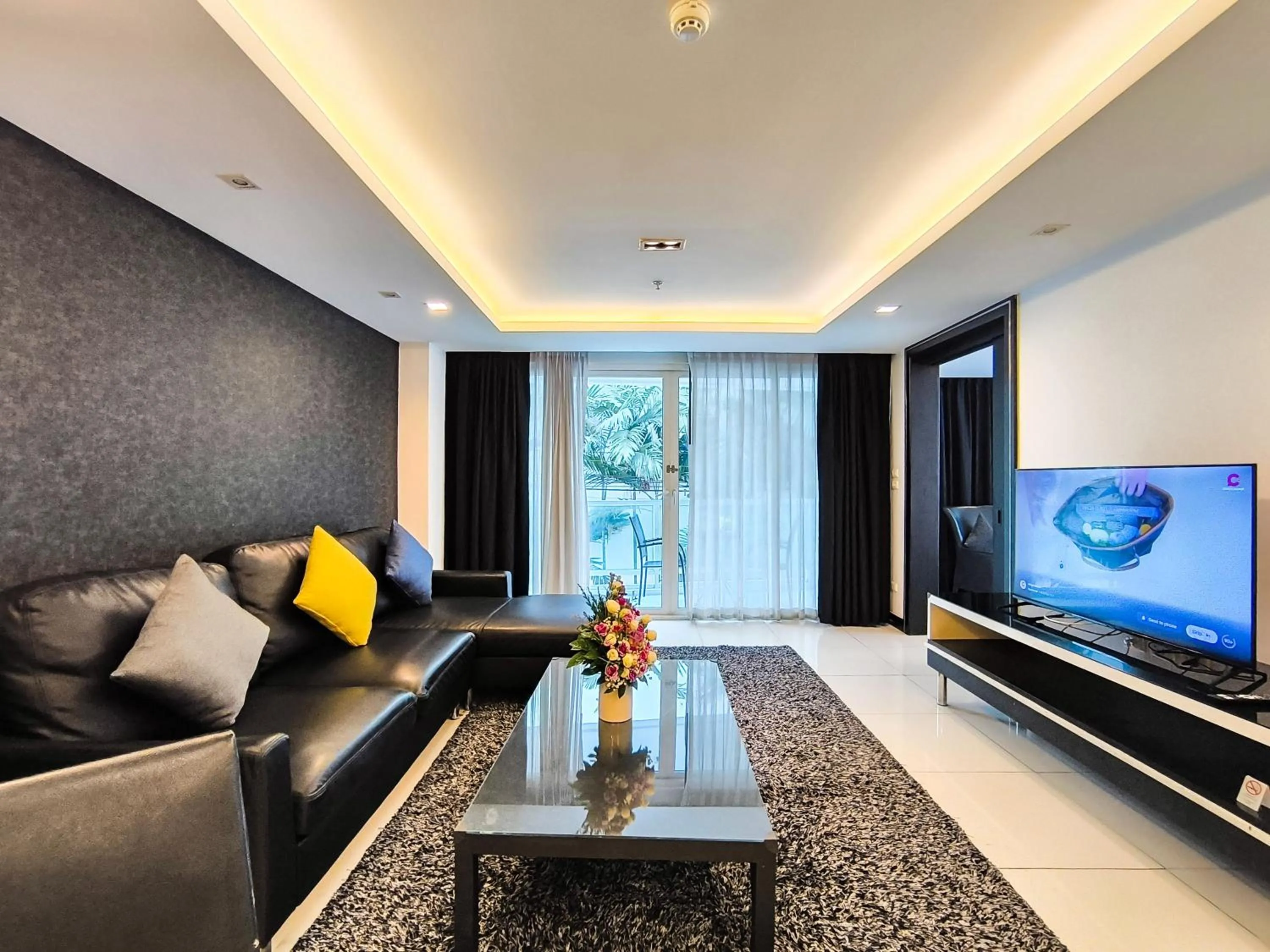 Living room in Nova Suites Pattaya by Compass Hospitality