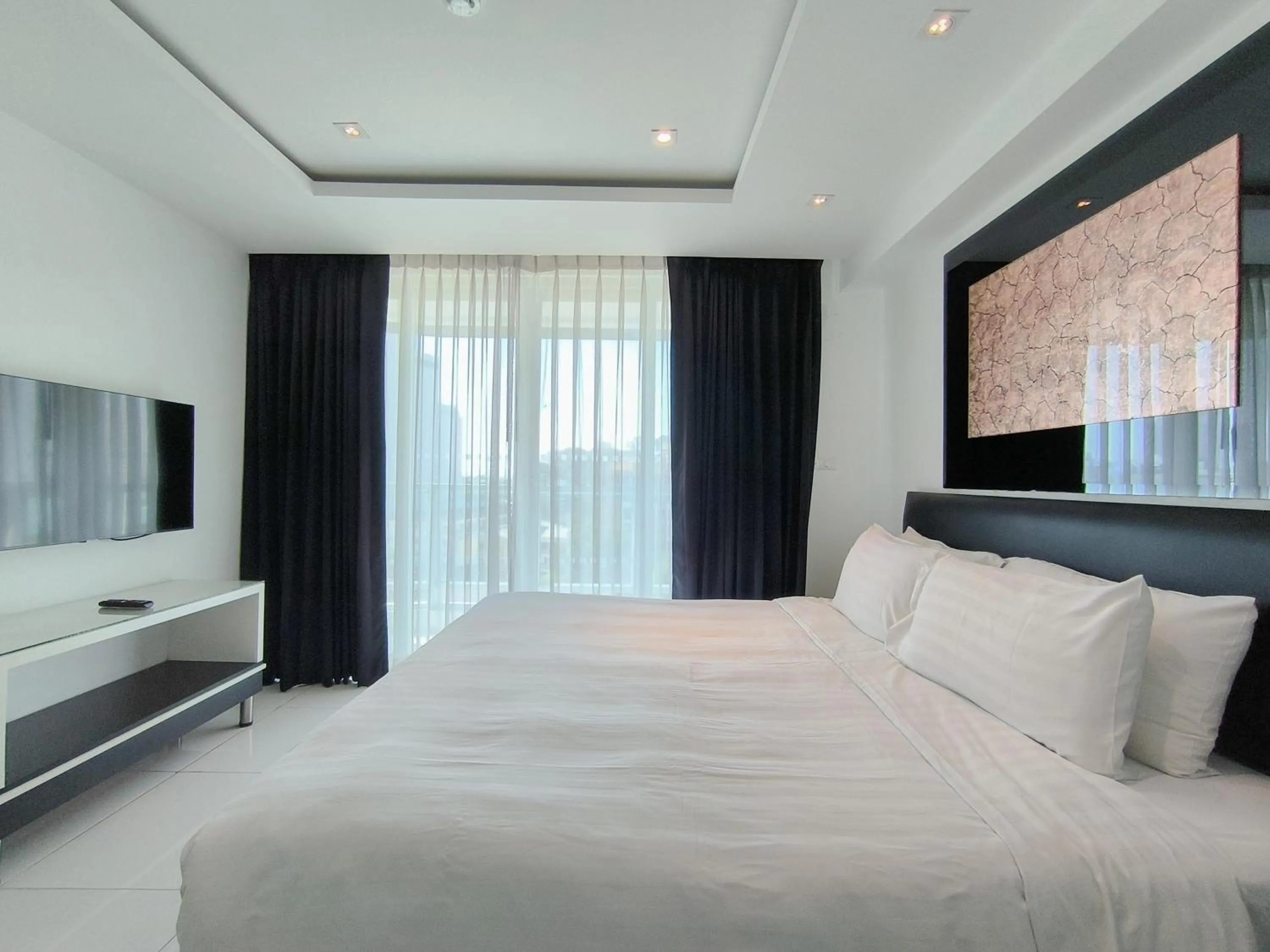 Bed in Nova Suites Pattaya by Compass Hospitality