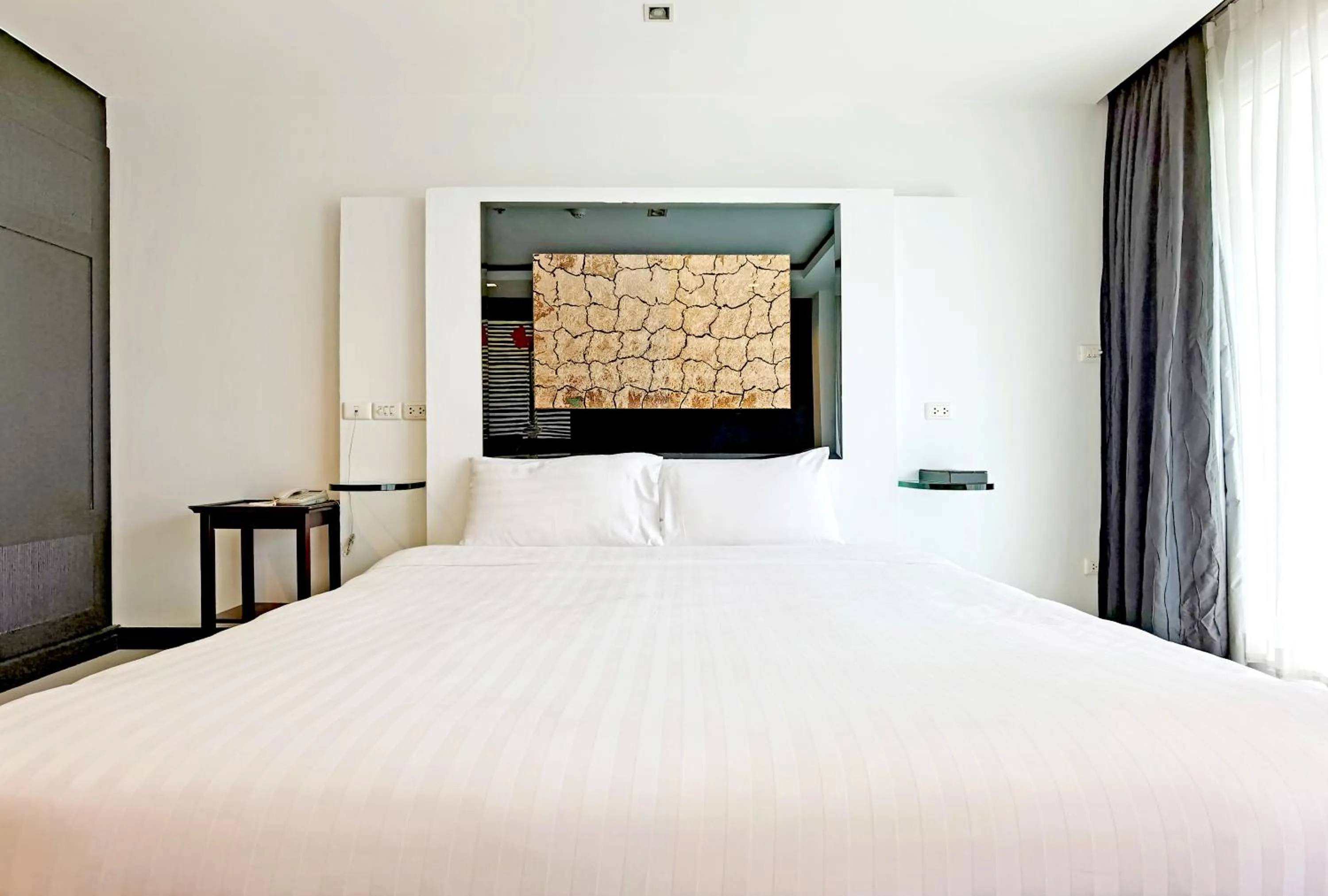 Bed in Nova Suites Pattaya by Compass Hospitality