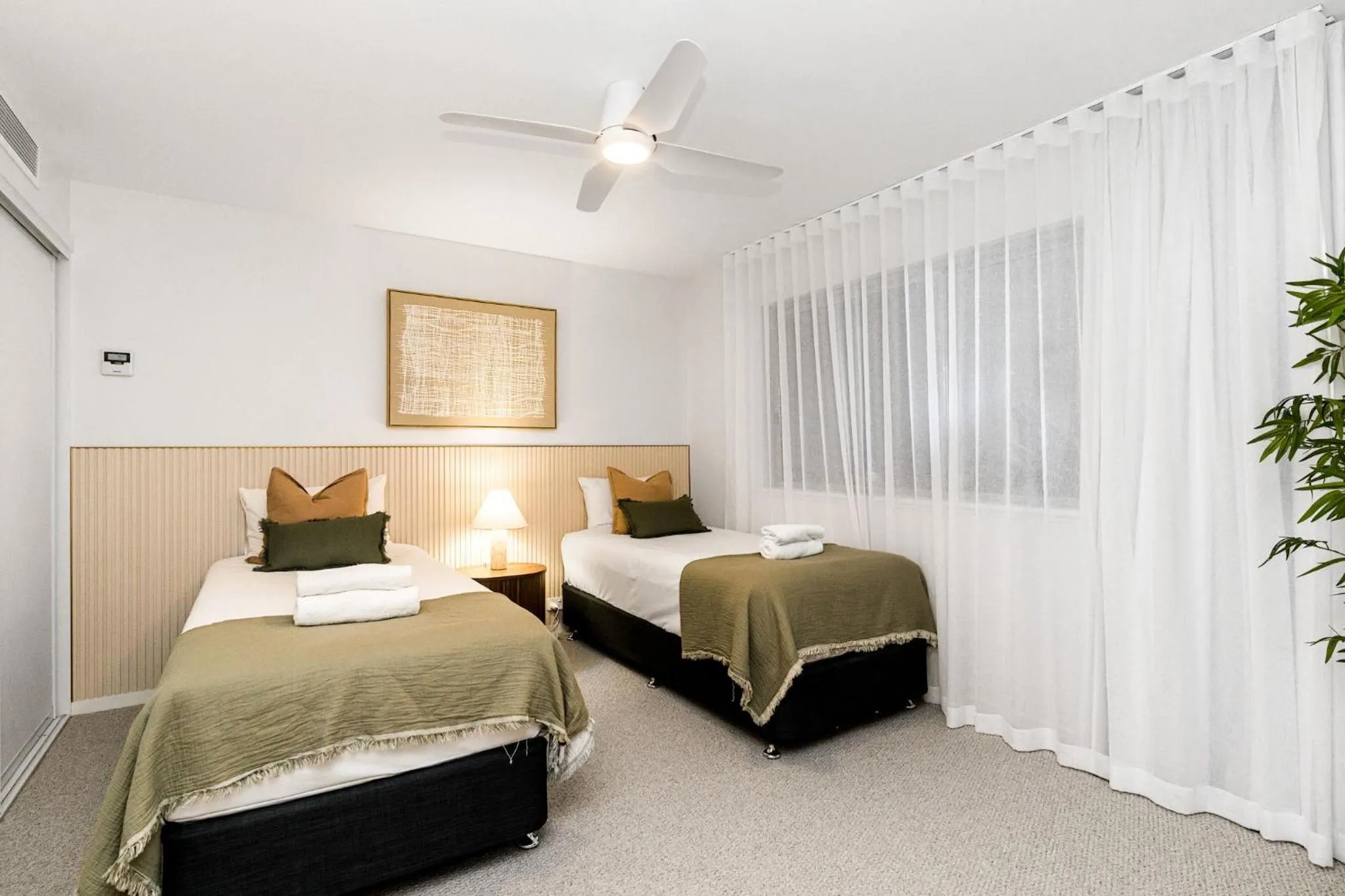 Bed in Riverside Apartments & Hotel