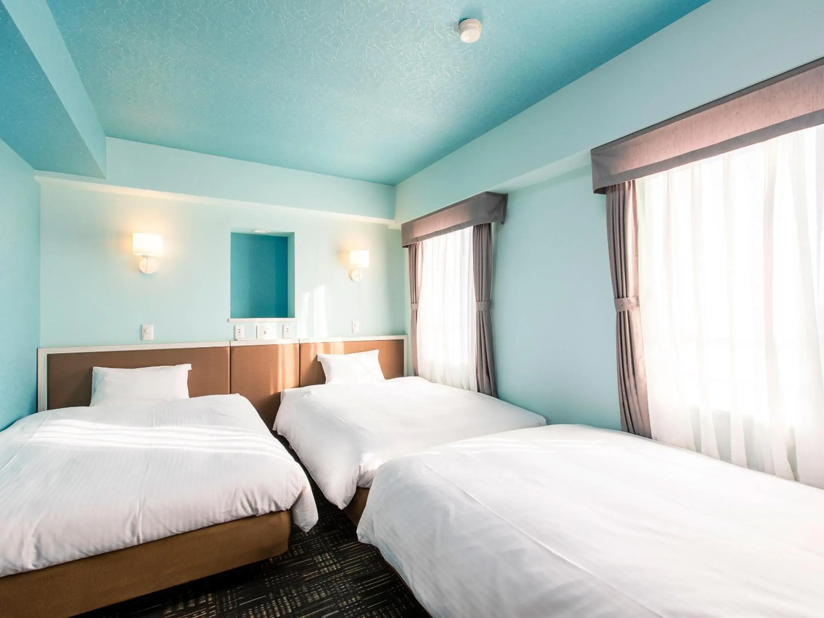 Bed in KOKO STAY Chitose - formerly Hotel Wing International Chitose Bed in KOKO STAY Chitose - formerly Hotel Wing International Chitose