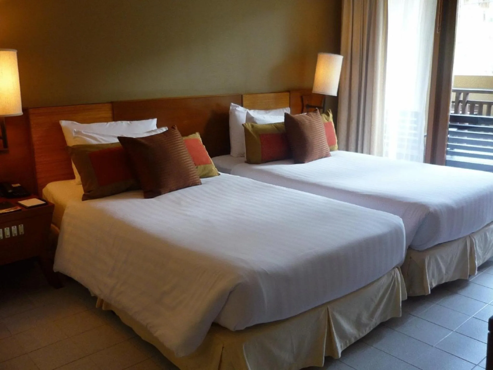 Bed in Impiana Beachfront Resort Chaweng Noi, Koh Samui