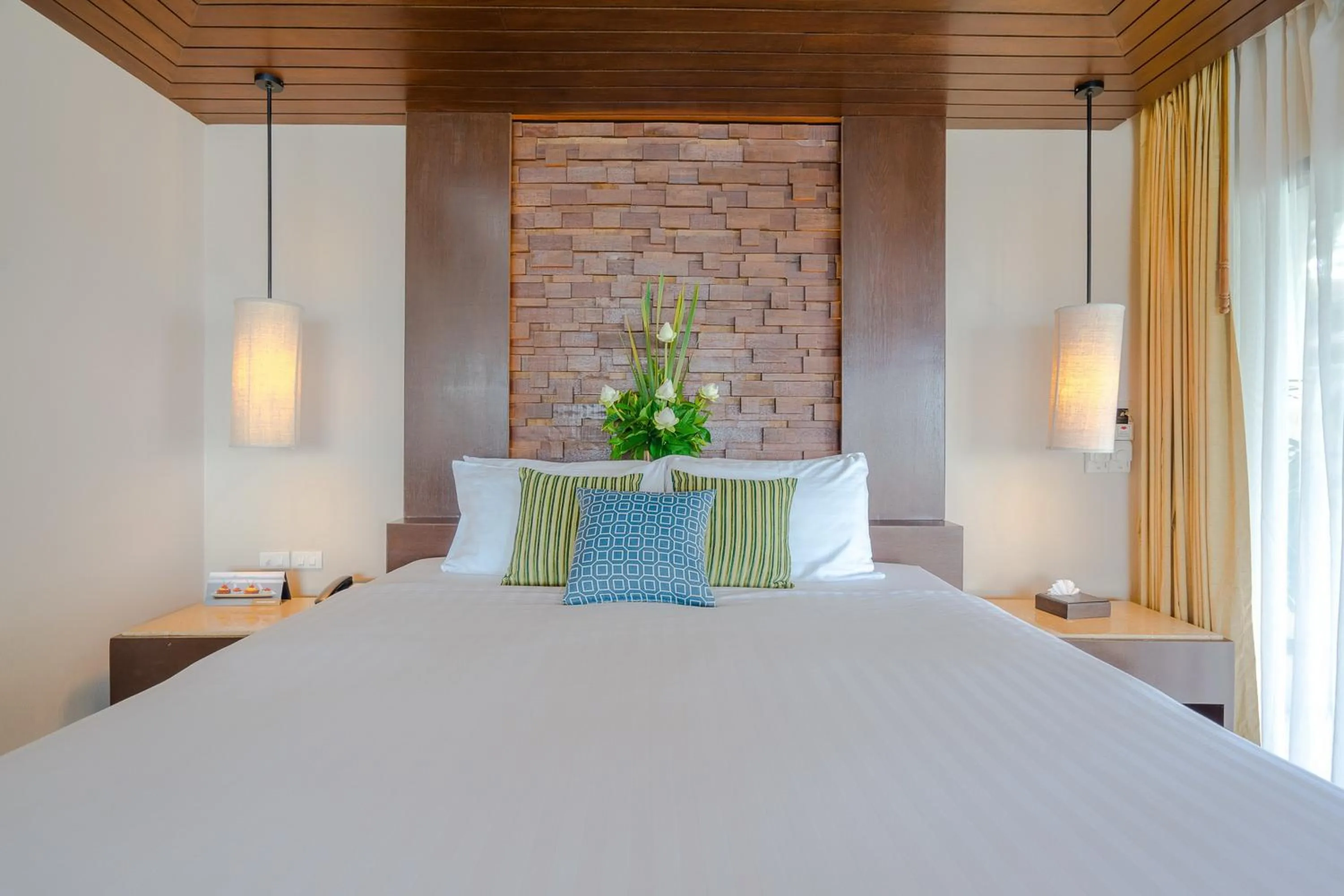 Bed in Impiana Beachfront Resort Chaweng Noi, Koh Samui