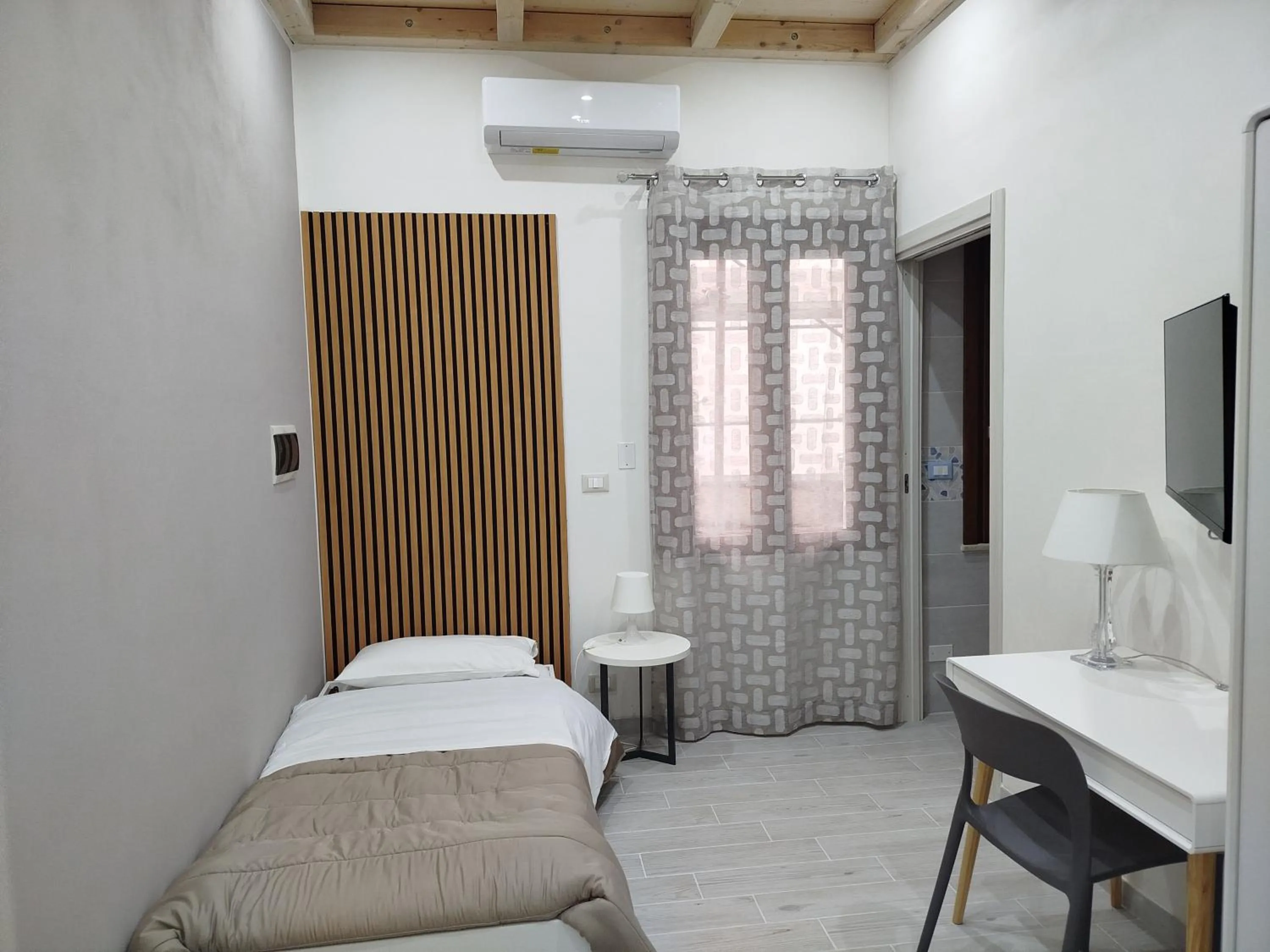 Photo of the whole room, Bed in Il Cortile Fiorito