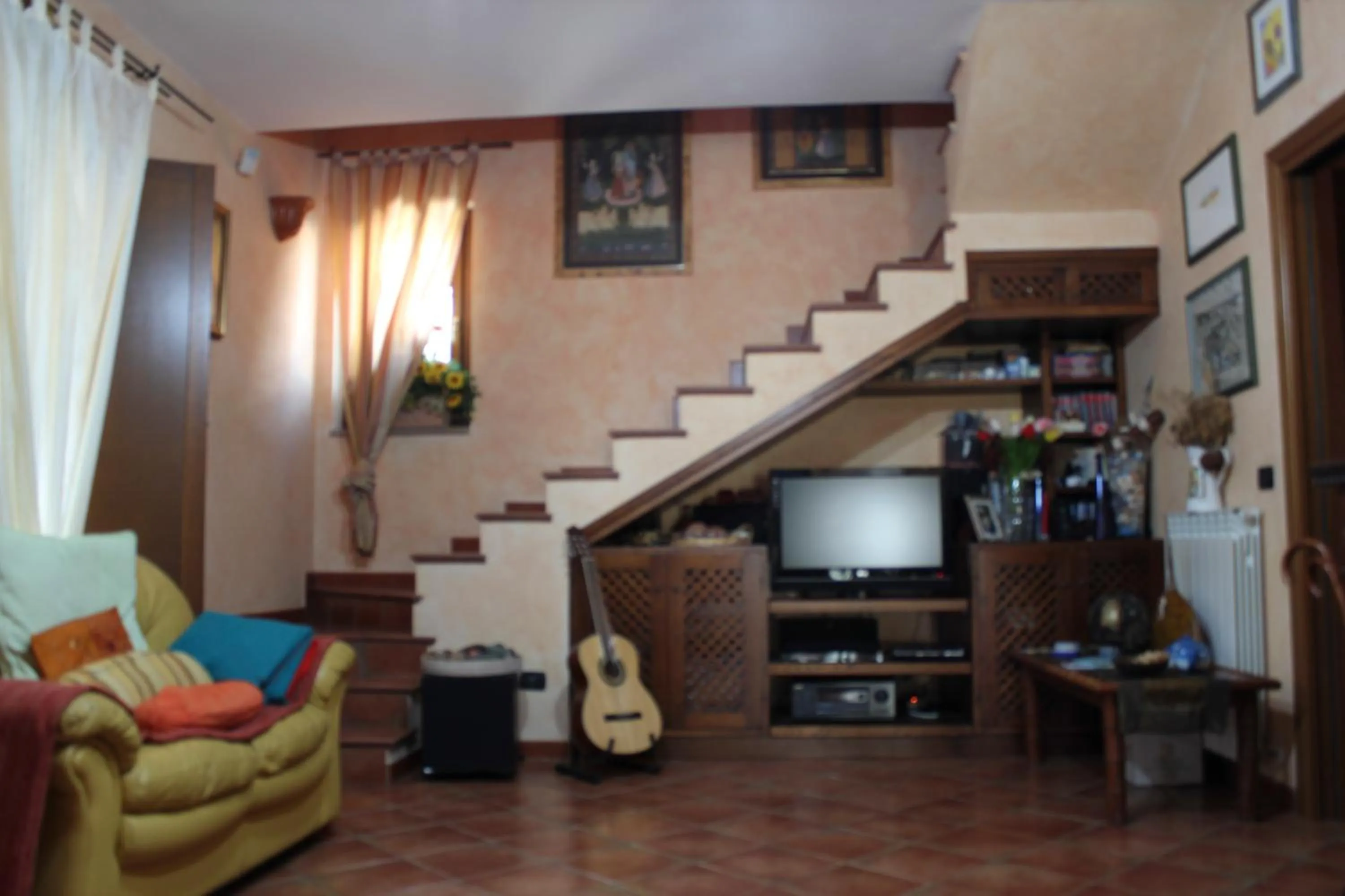 Communal lounge/ TV room in Paoline's suite in villa