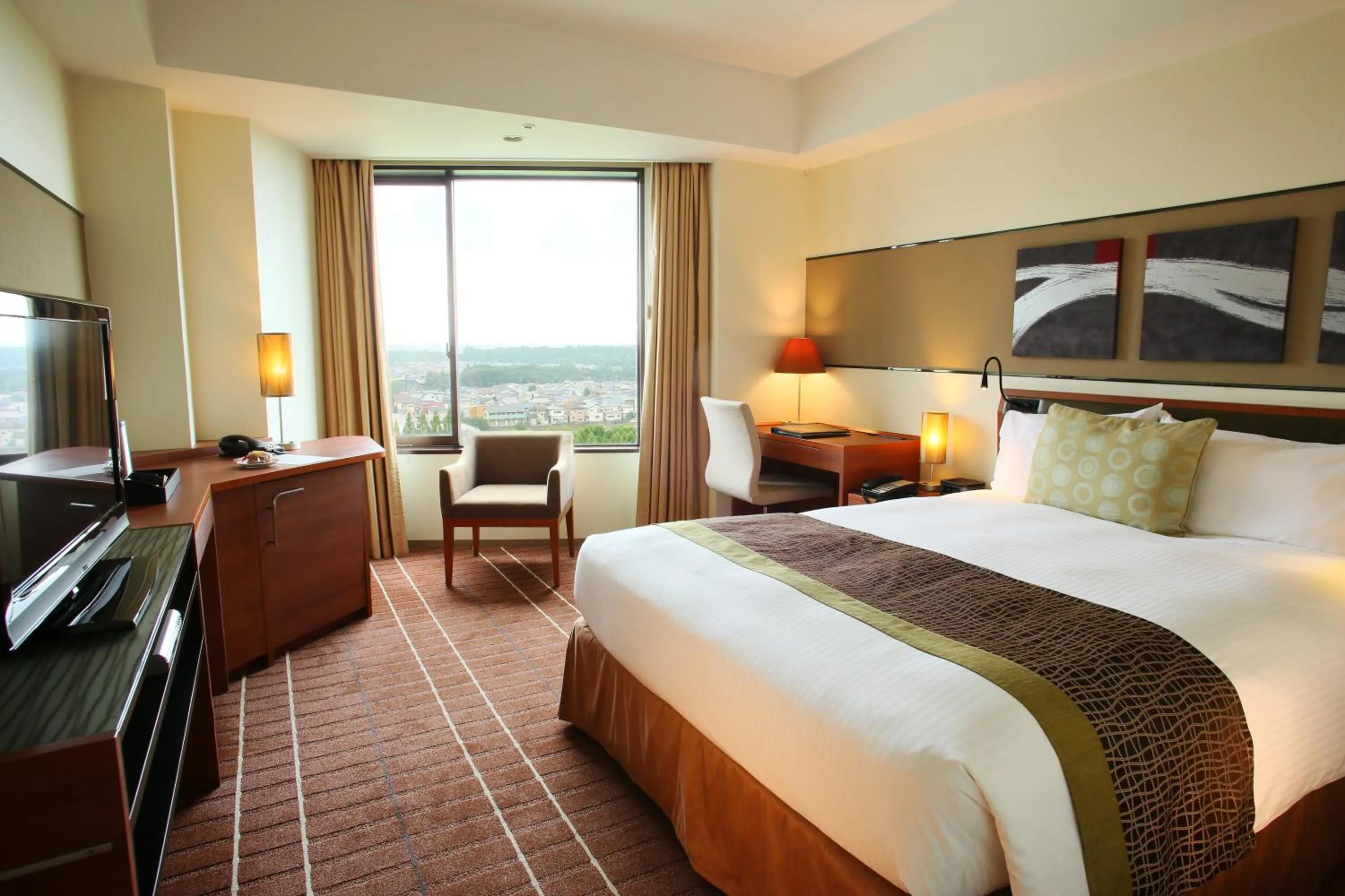 Bed in International Resort Hotel Yurakujo