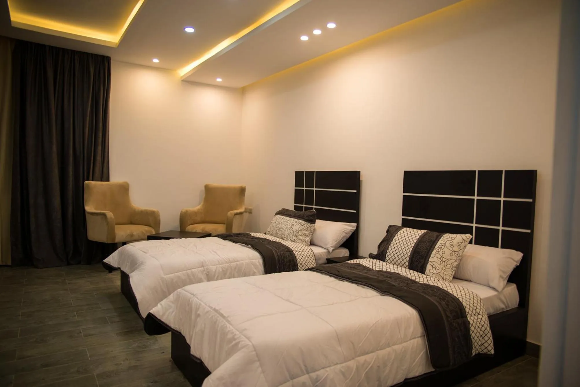 Seating area, Bed in Marvel Stone Hotel