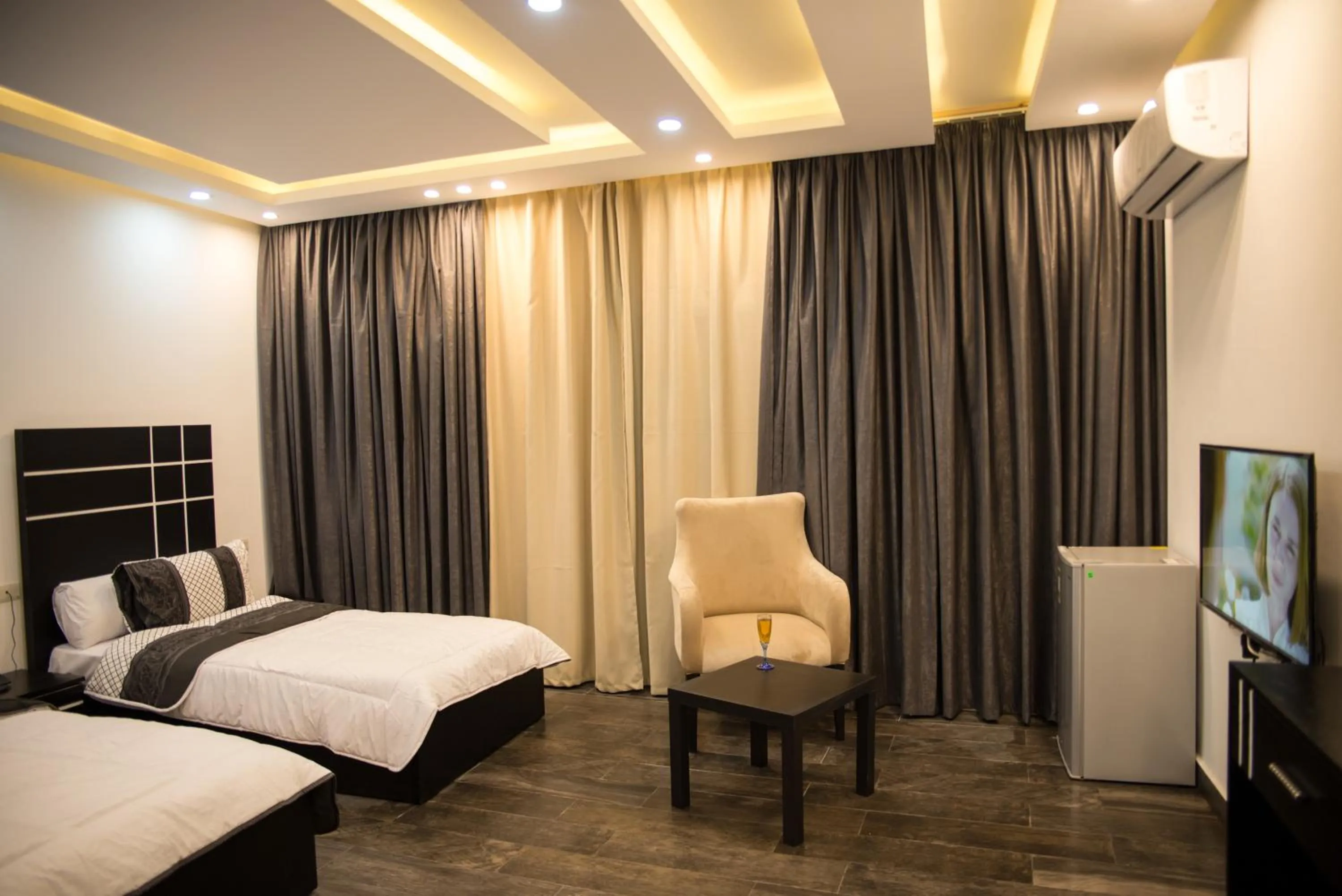 Seating area, Bed in Marvel Stone Hotel