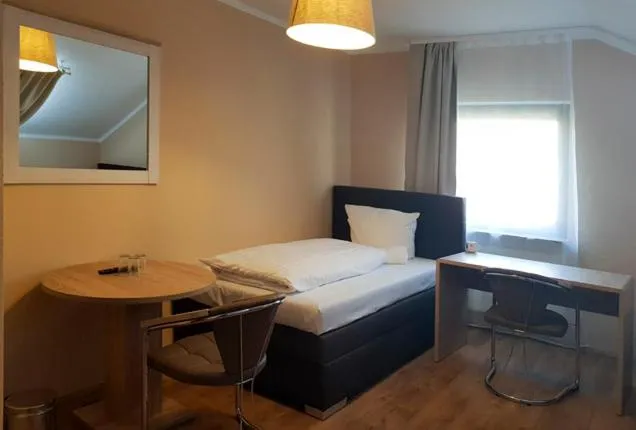 Photo of the whole room, Bed in Hotel-Residenz Oberurseler Hof