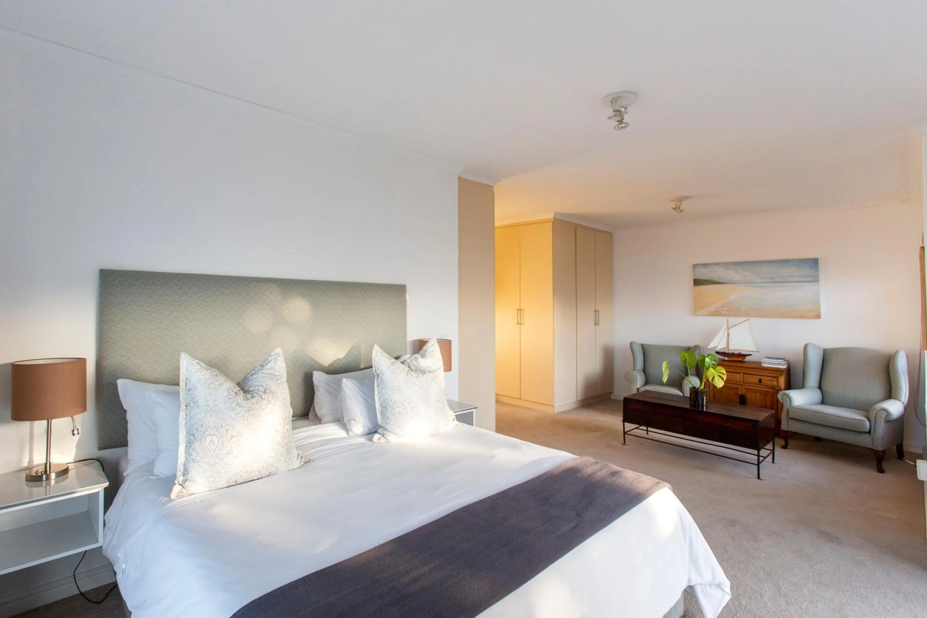 Seating area, Bed in Infinity Blue Luxury Accommodation