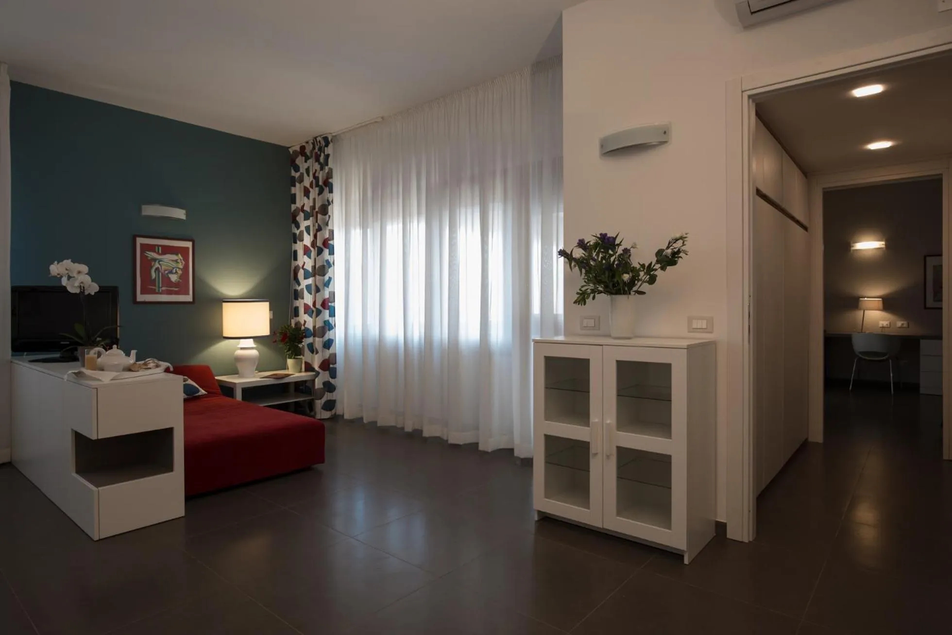 Seating area, Bed in Marbela Apartments & Suites