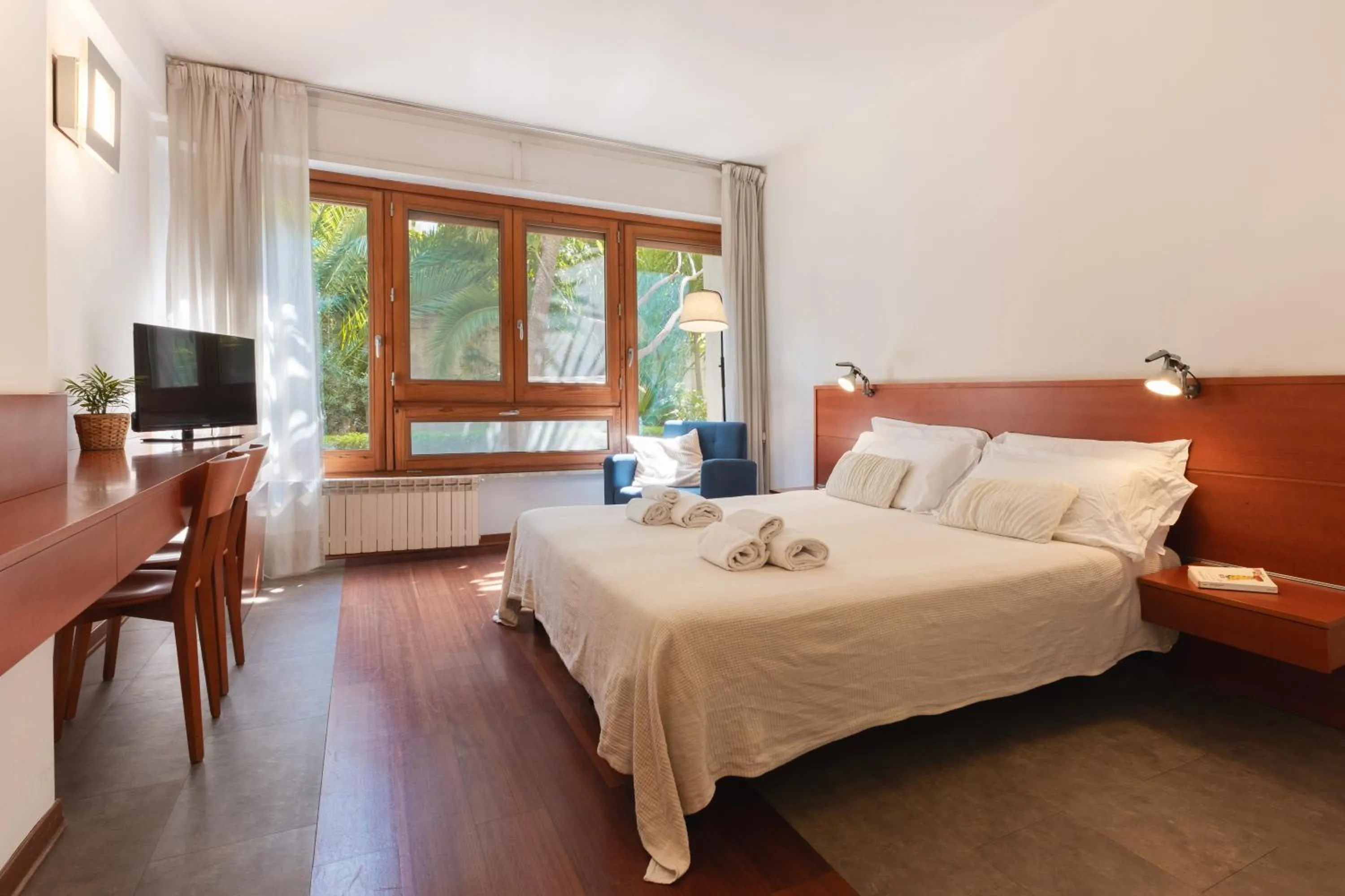 Bed in Marbela Apartments & Suites