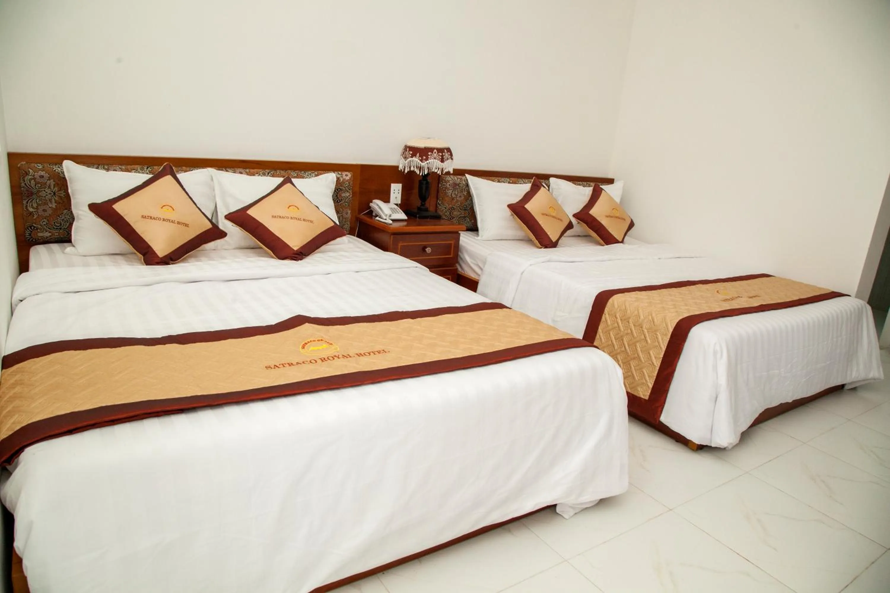 Bed in Satraco Royal Hotel