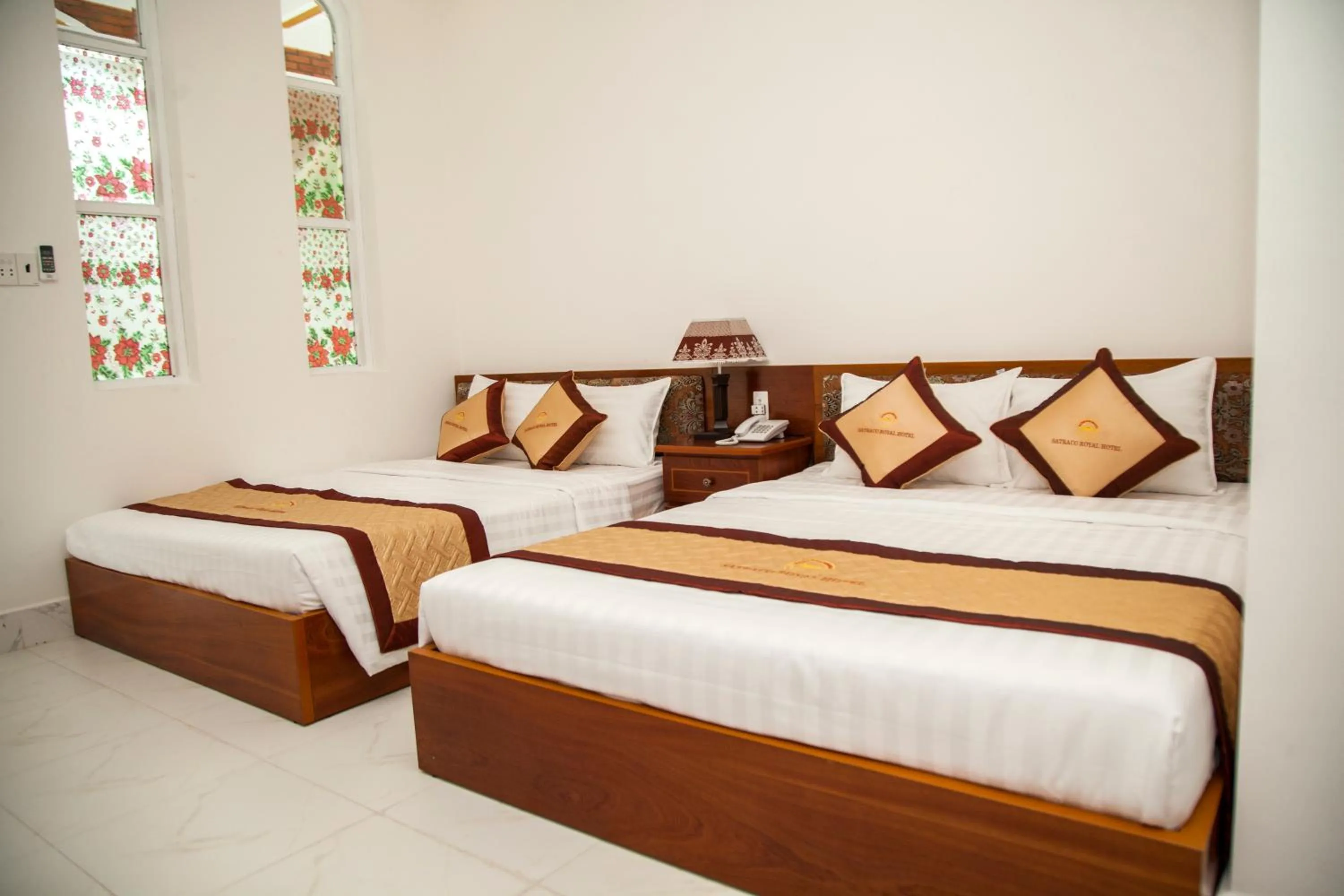 Bed in Satraco Royal Hotel