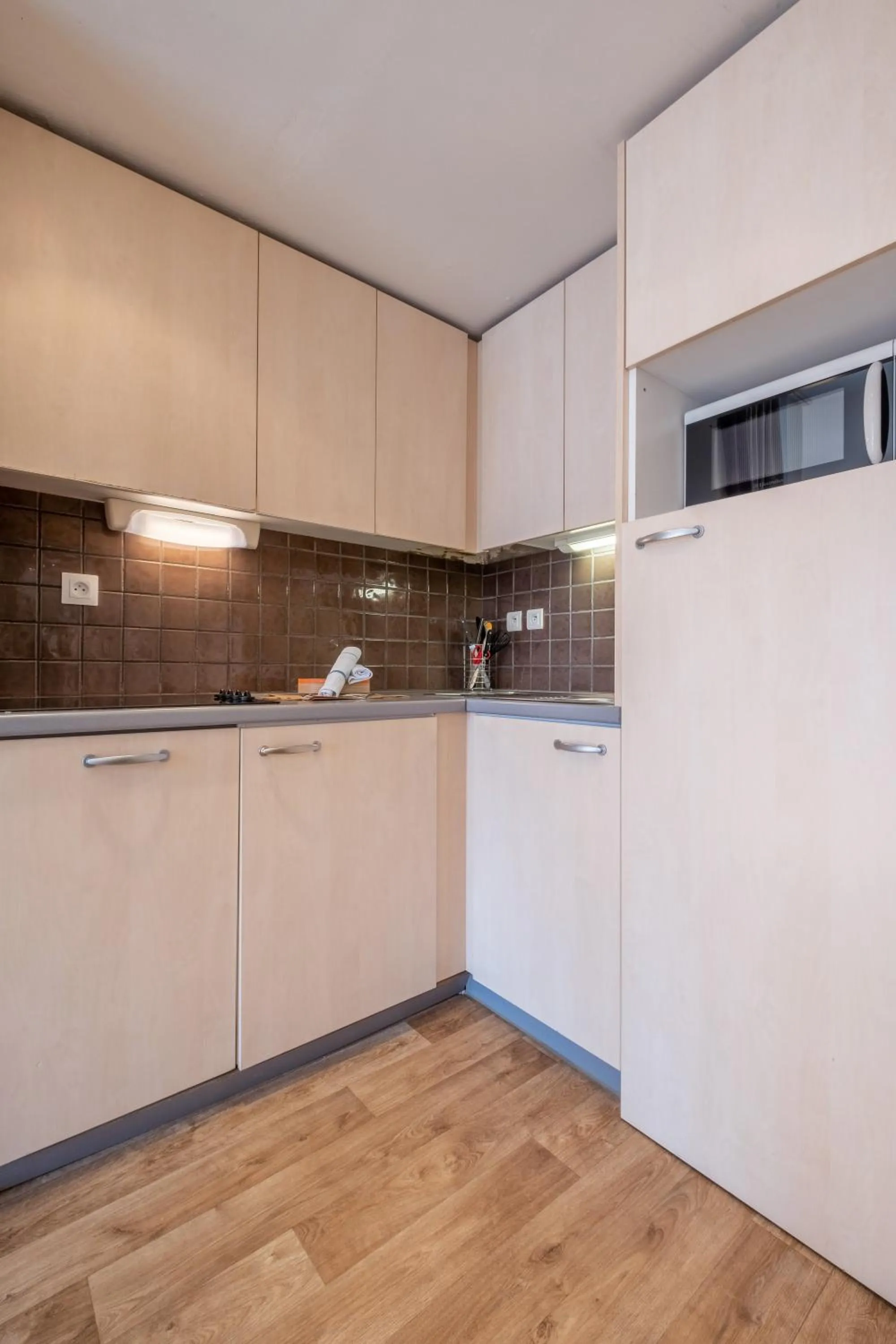 Kitchen or kitchenette in Résidence Pierre & Vacances La Forêt