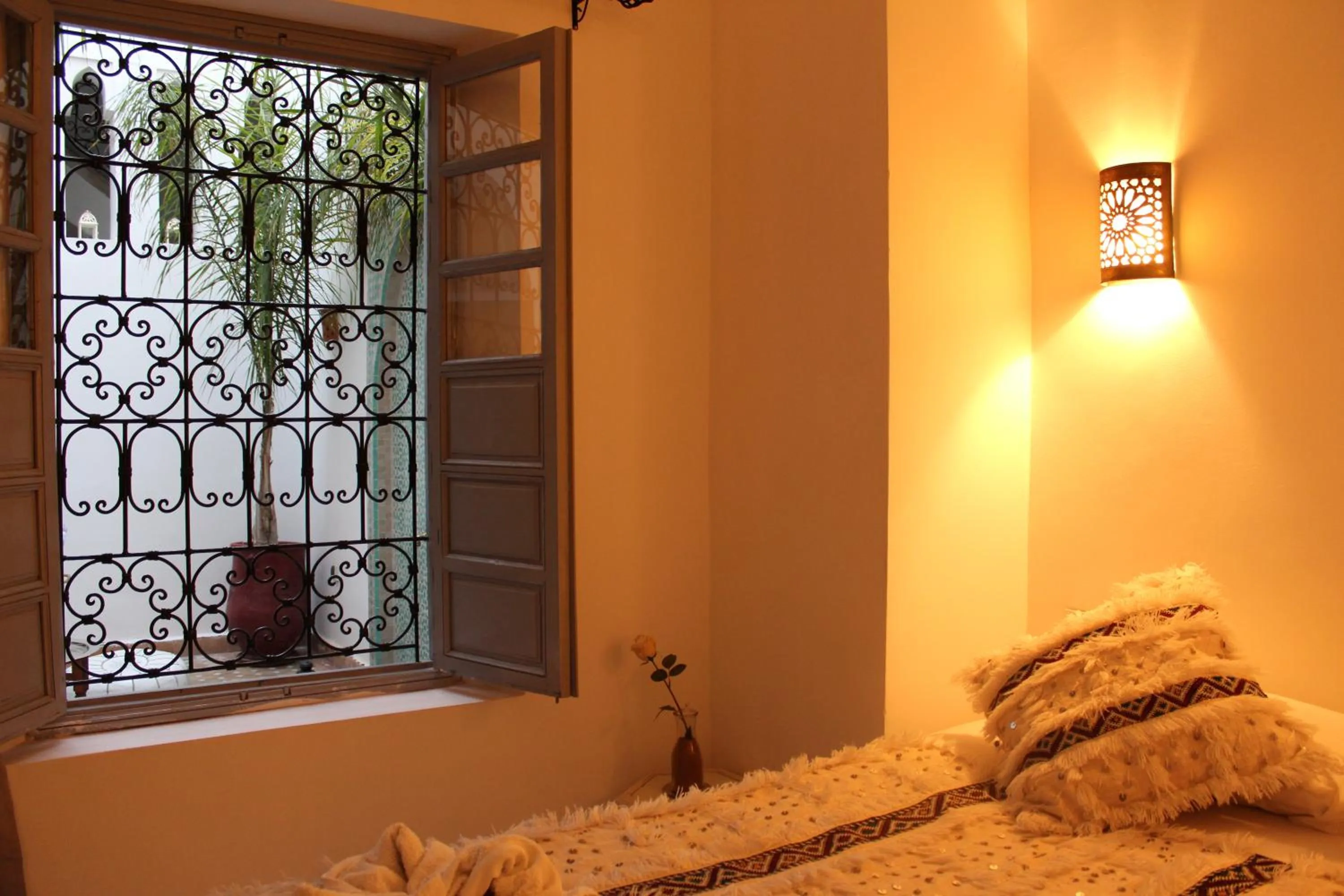 Inner courtyard view, Bed in Riad El Arco ROOFTOP POOL & Spa