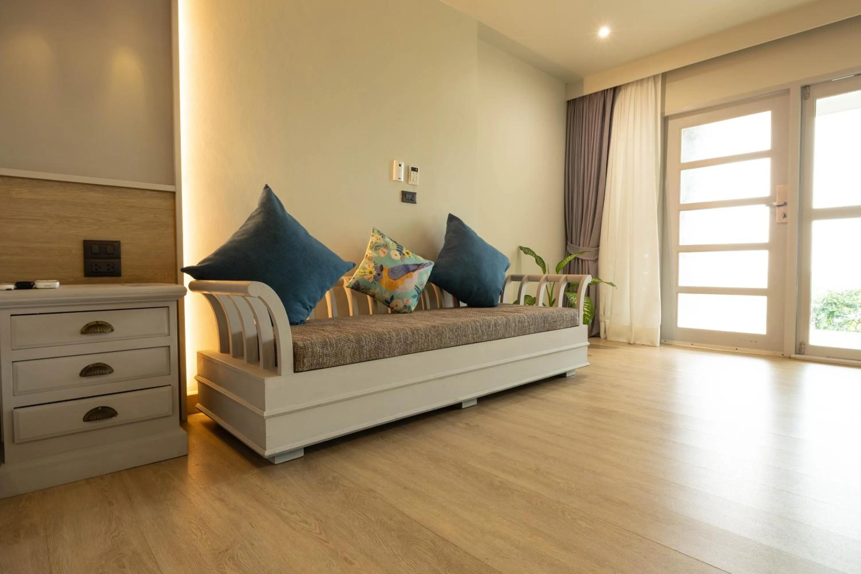 Seating area, Bed in Andaman Cannacia Resort & Spa - SHA Extra Plus