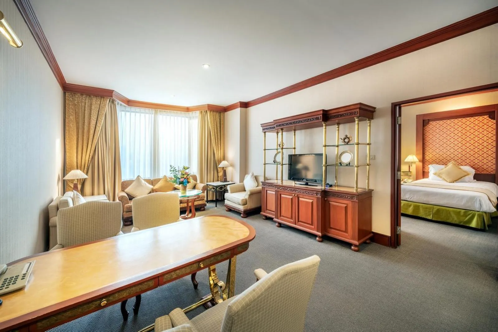 Living room in Ramada by Wyndham Bangkok Chaophya Park