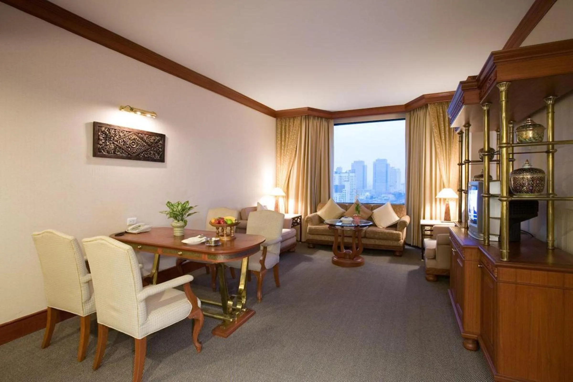 Living room in Ramada by Wyndham Bangkok Chaophya Park