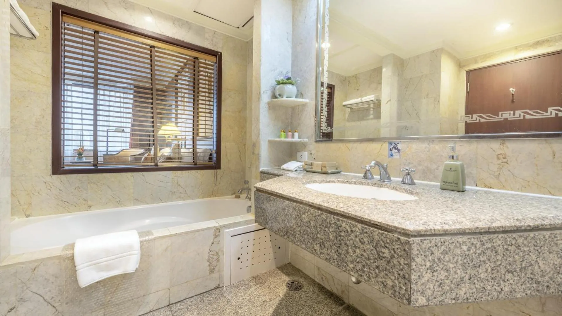 Bathroom in Ramada by Wyndham Bangkok Chaophya Park