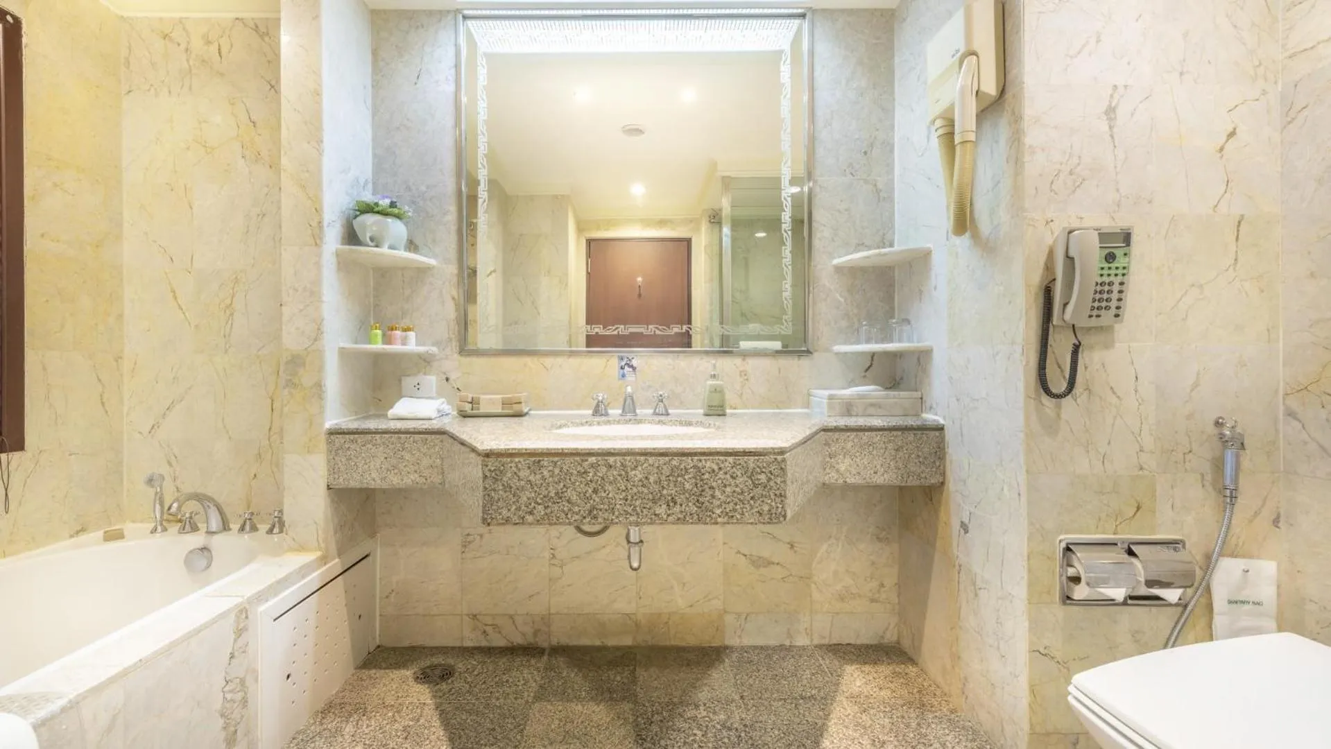 Bathroom in Ramada by Wyndham Bangkok Chaophya Park