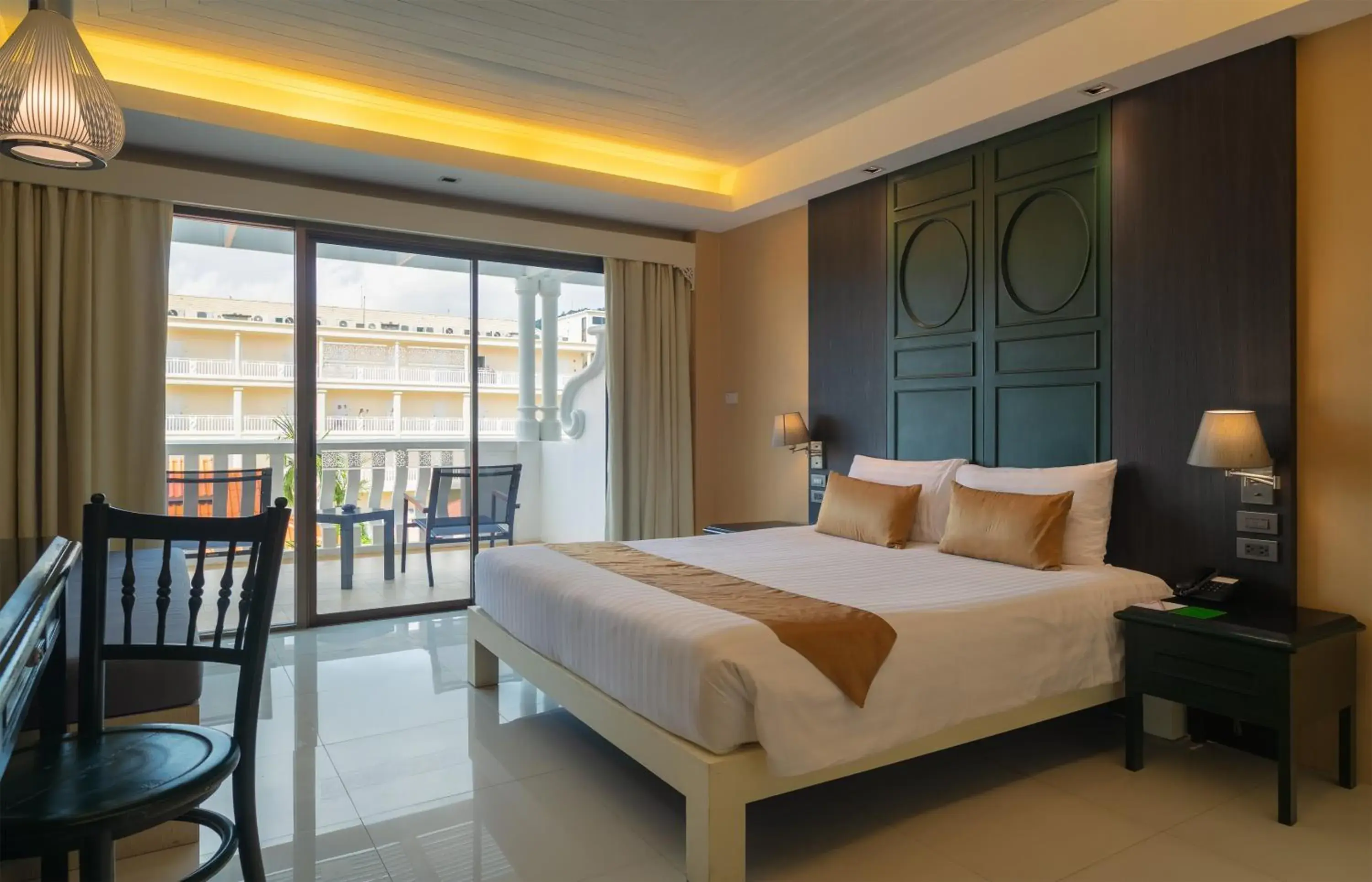 Bed in The Old Phuket - Karon Beach Resort Bed in The Old Phuket - Karon Beach Resort