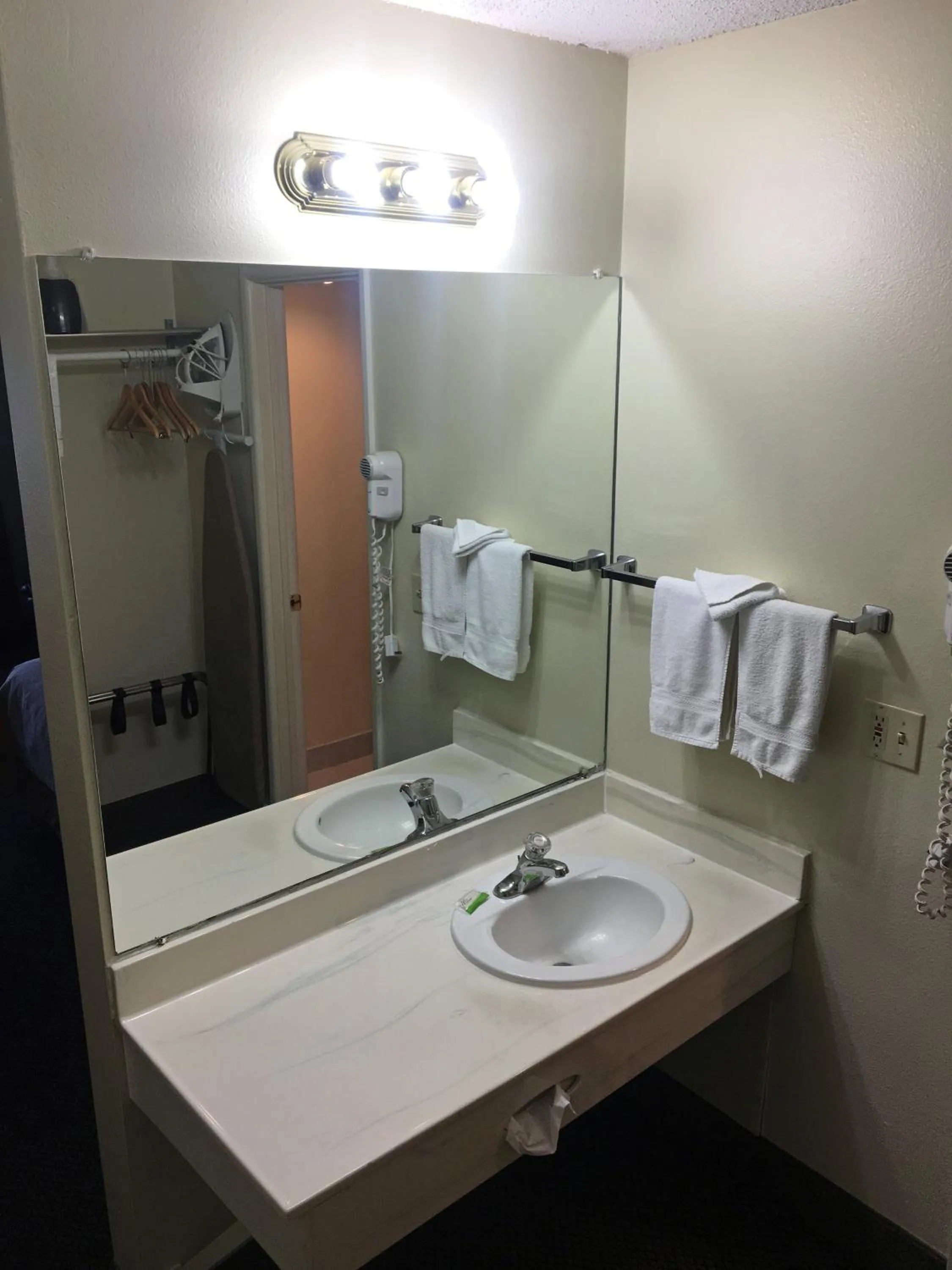 Bathroom in FairBridge Extended Stay, a Kitchenette Hotel
