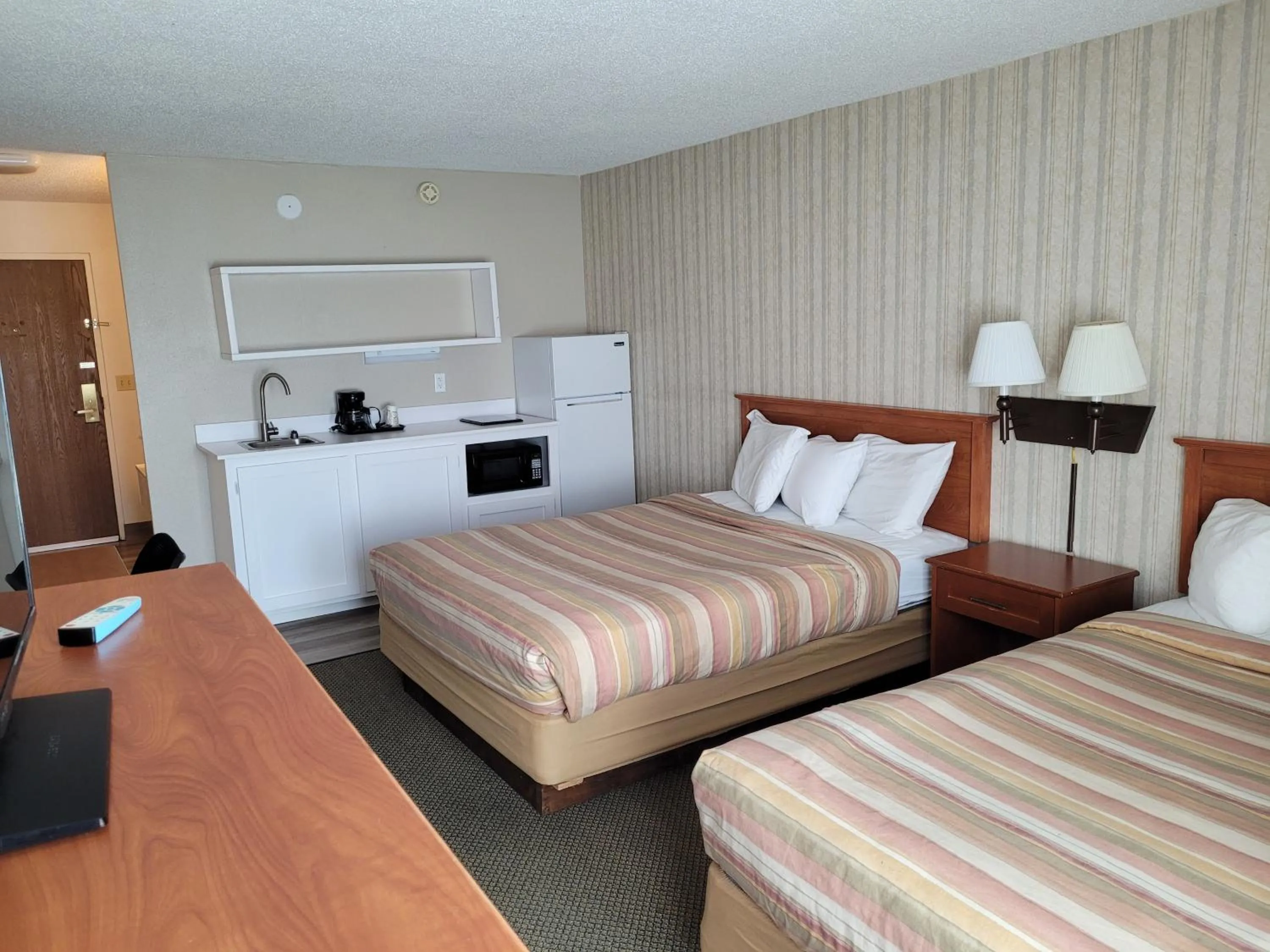Photo of the whole room, Bed in FairBridge Extended Stay, a Kitchenette Hotel