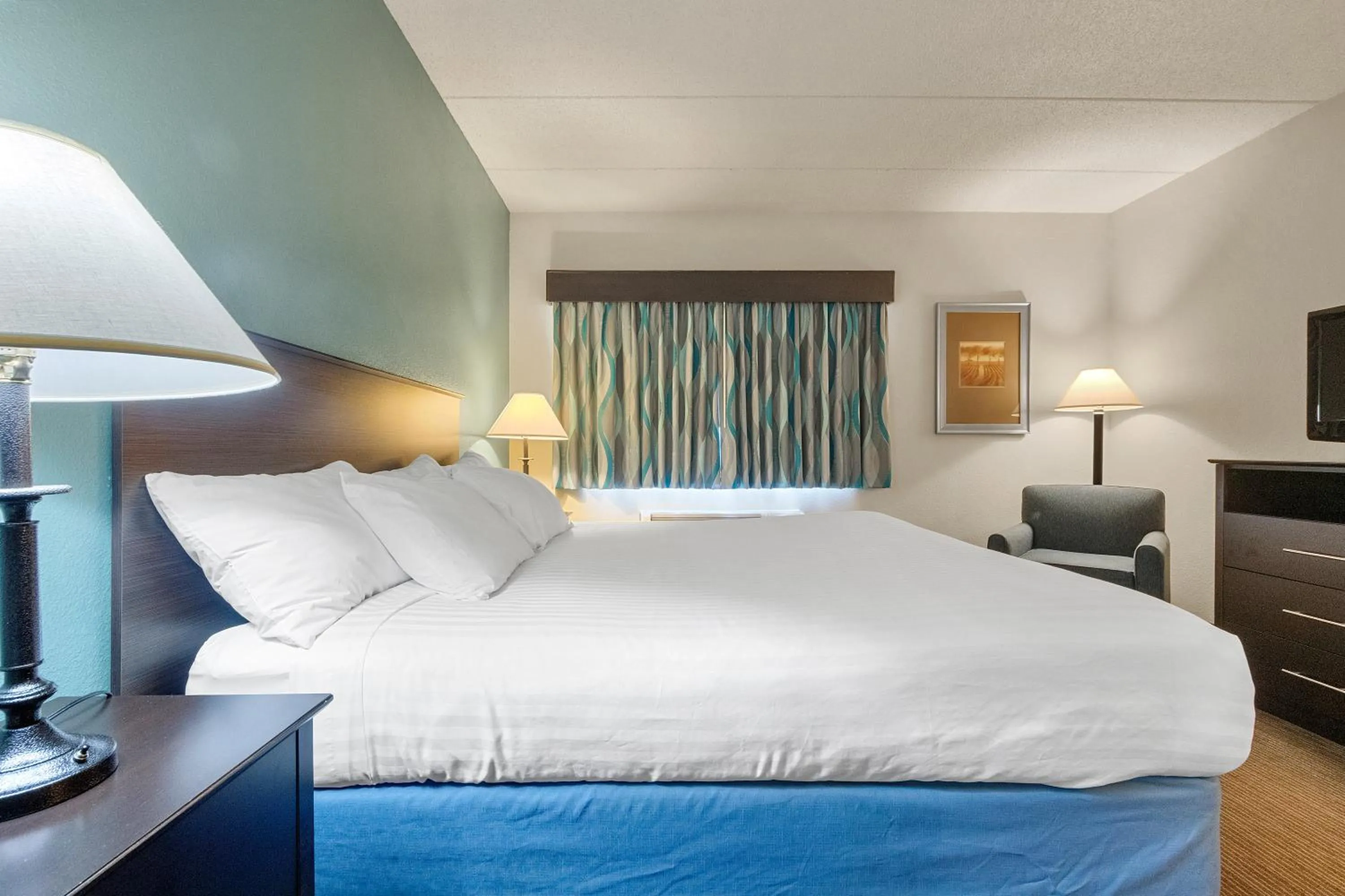 Bed in AmericInn by Wyndham Green Bay East